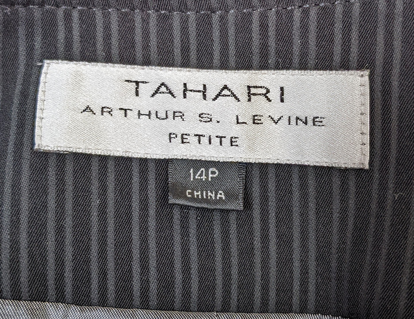 Tahari by Arthur S. Levine Black Pinstripe Suit Jacket Elevate your professional wardrobe with the Tahari by Arthur S. Levine Black Pinstripe Suit Jacket. Featuring