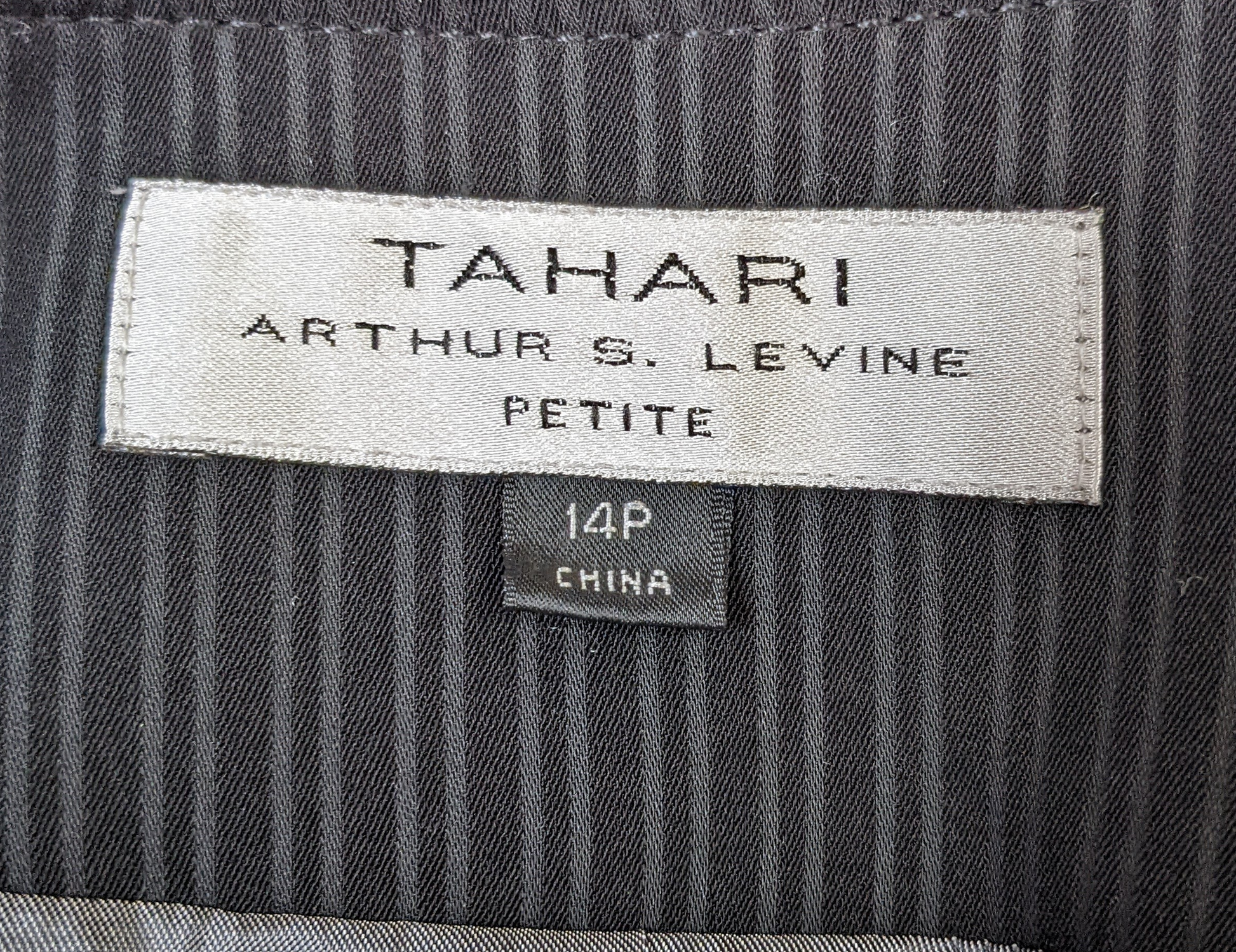 Tahari by Arthur S. Levine Black Pinstripe Suit Jacket Elevate your professional wardrobe with the Tahari by Arthur S. Levine Black Pinstripe Suit Jacket. Featuring