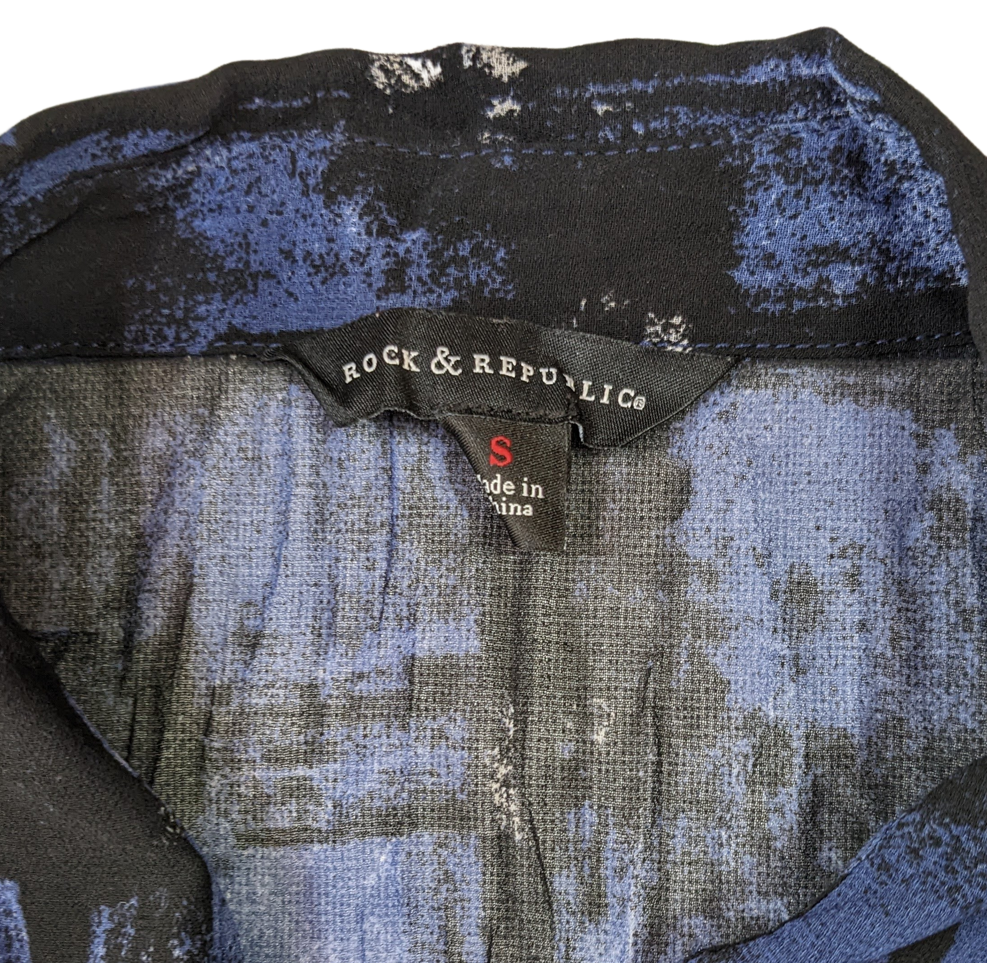 Rock & Republic Crinkle Sheer Blue and Black Button up Blouse  Add a touch of rock and roll to your style with this Rock & Republic Crinkle Sheer Blue and Black Button
