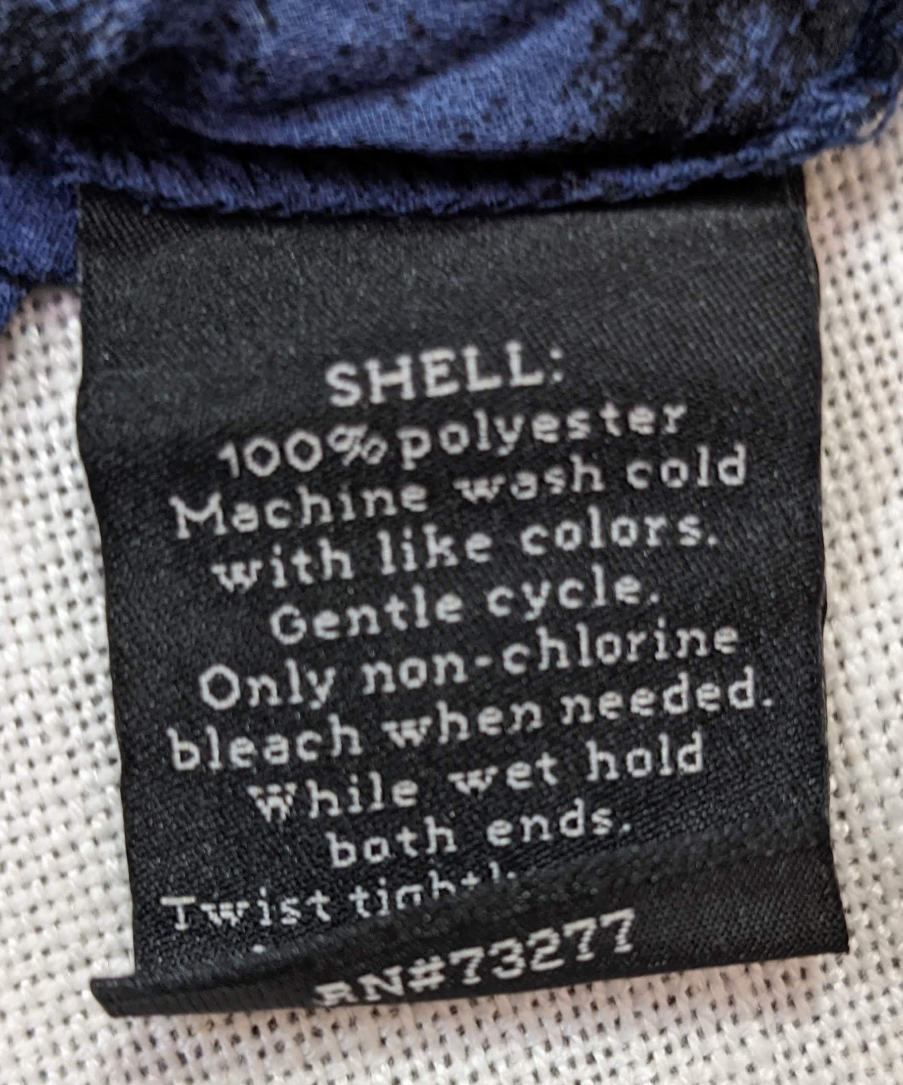 Rock & Republic Crinkle Sheer Blue and Black Button up Blouse  Add a touch of rock and roll to your style with this Rock & Republic Crinkle Sheer Blue and Black Button