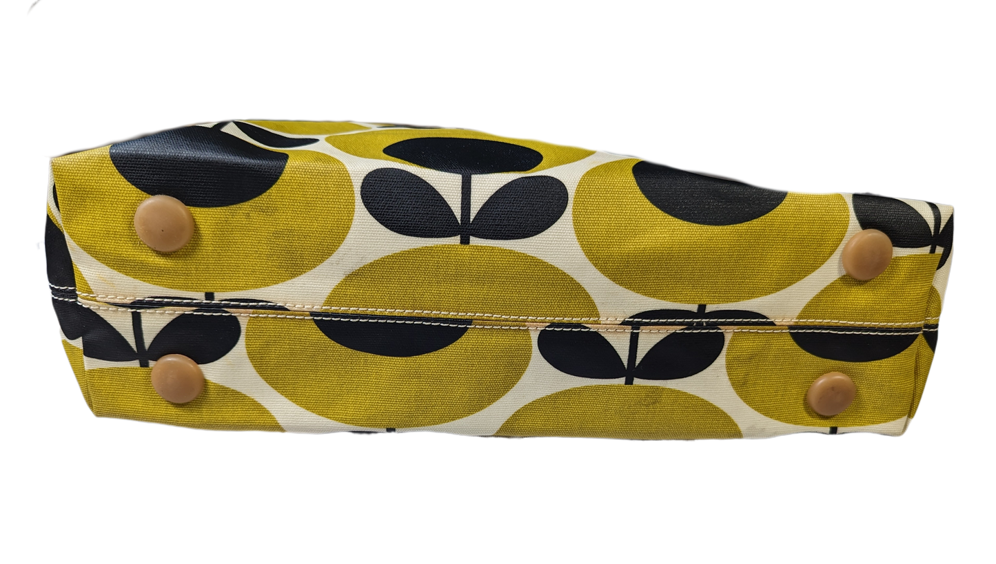 Orla Kiely Rare Mustard Forget-Me-Not Shoulder BagThis bag has such style. It is coated canvas and in excellent condition.  There is some discoloration along the top edge, and on the bottom seam that is detailed in Orla Kiely Rare Mustard Forget-Handbag