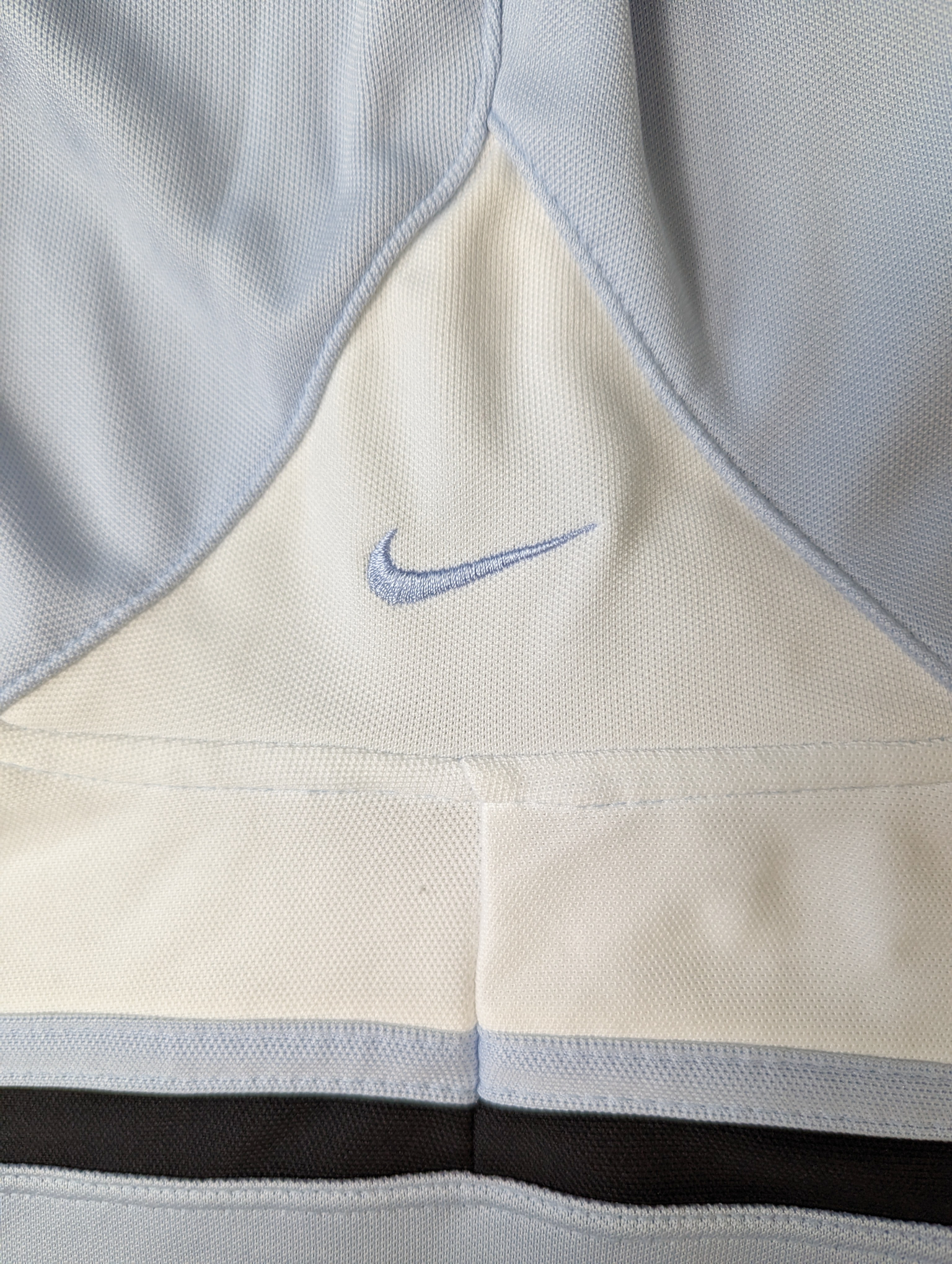 Nike Athletic Jacket With Hood Cool Baby Blue color on this cool jacket!  Great pockets on front, stripes on the sleeves and a logo on the back of the hood!