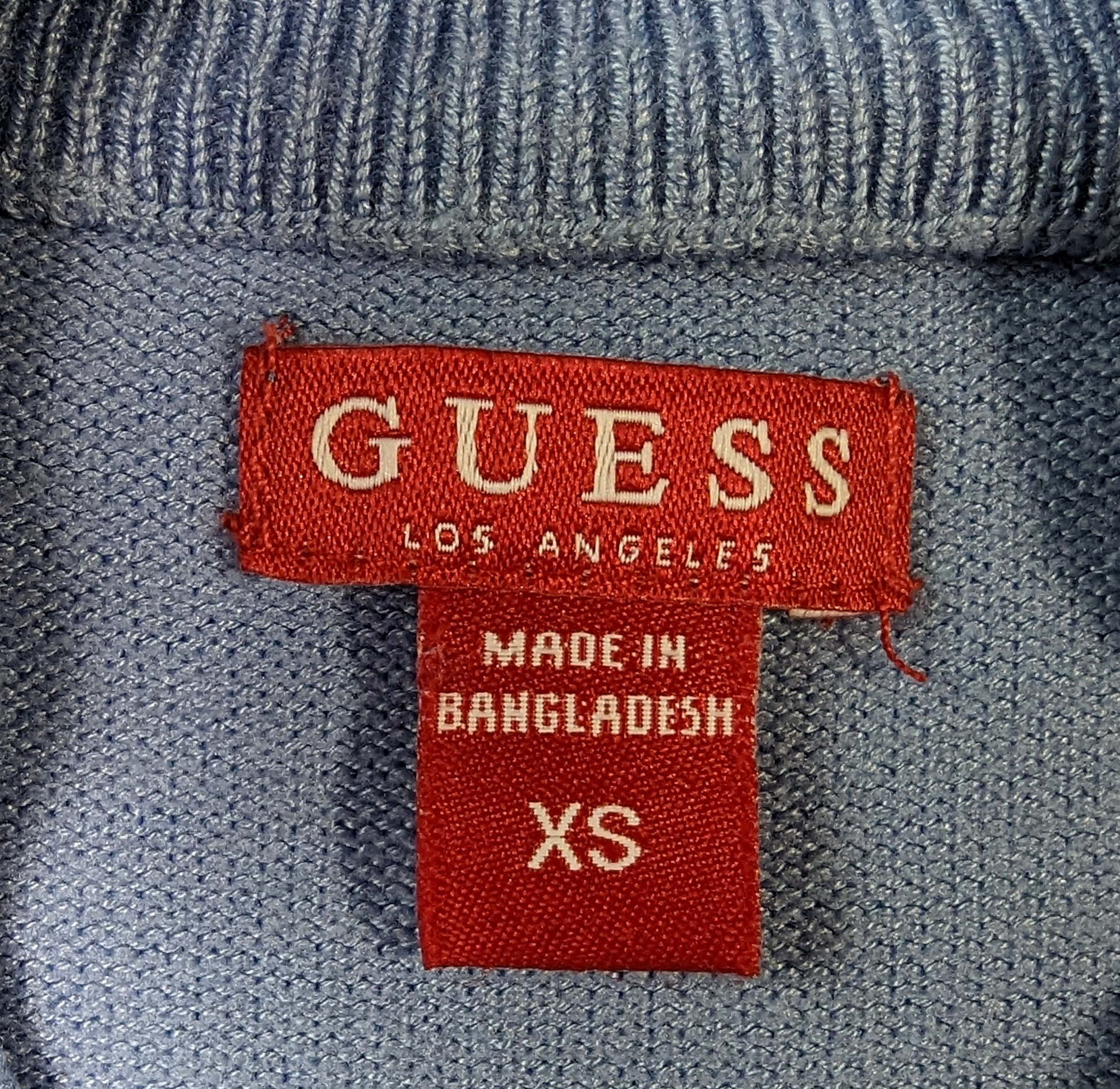 Guess Mock Neck Logo Sweater Great Styling and cozy too!  You can't go wrong when you warm up with this soft sweater!