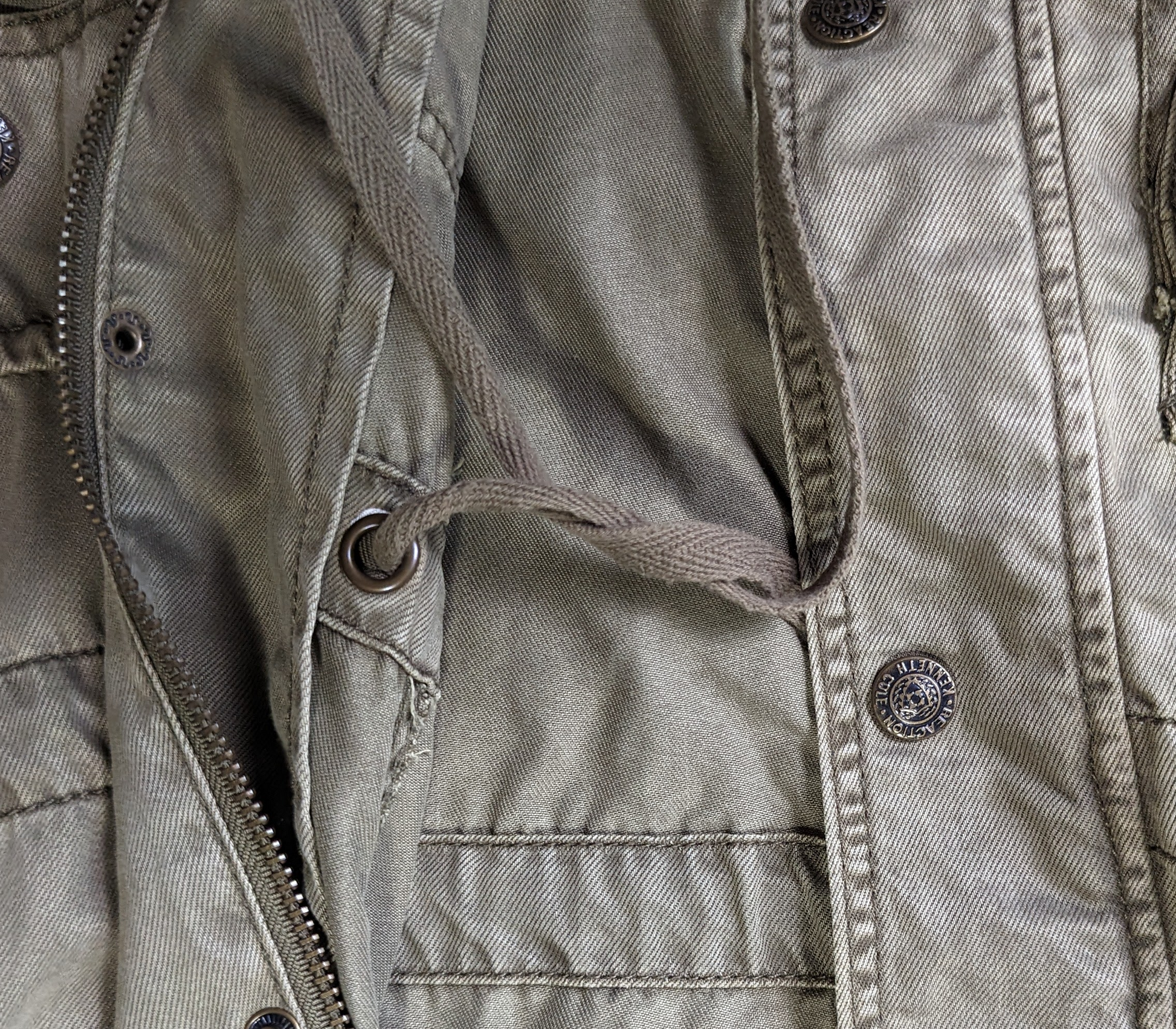 Kenneth Cole Reaction Utility VestYou will have a place for everything with this great vest from Kenneth Cole.  It has lots of pockets and a zip-up, snap front and a hood!  It also has a drawstring w