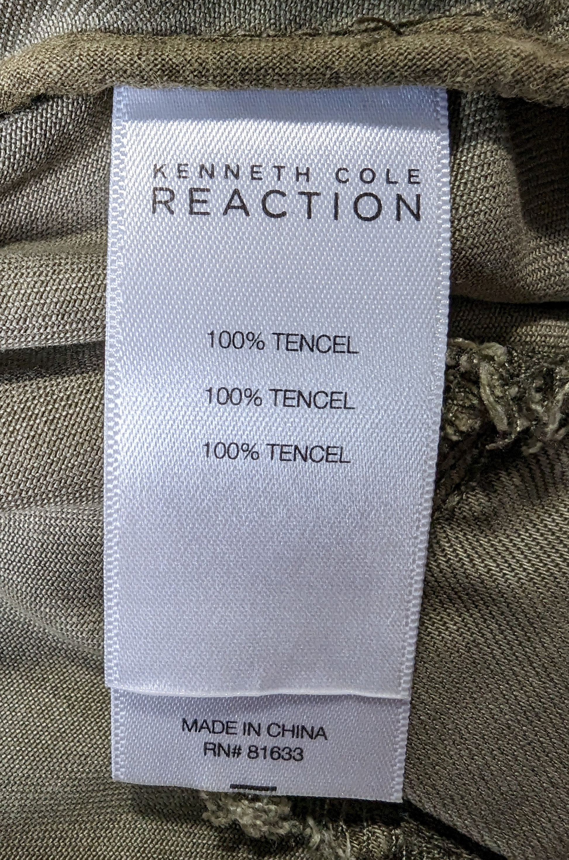 Kenneth Cole Reaction Utility VestYou will have a place for everything with this great vest from Kenneth Cole.  It has lots of pockets and a zip-up, snap front and a hood!  It also has a drawstring w
