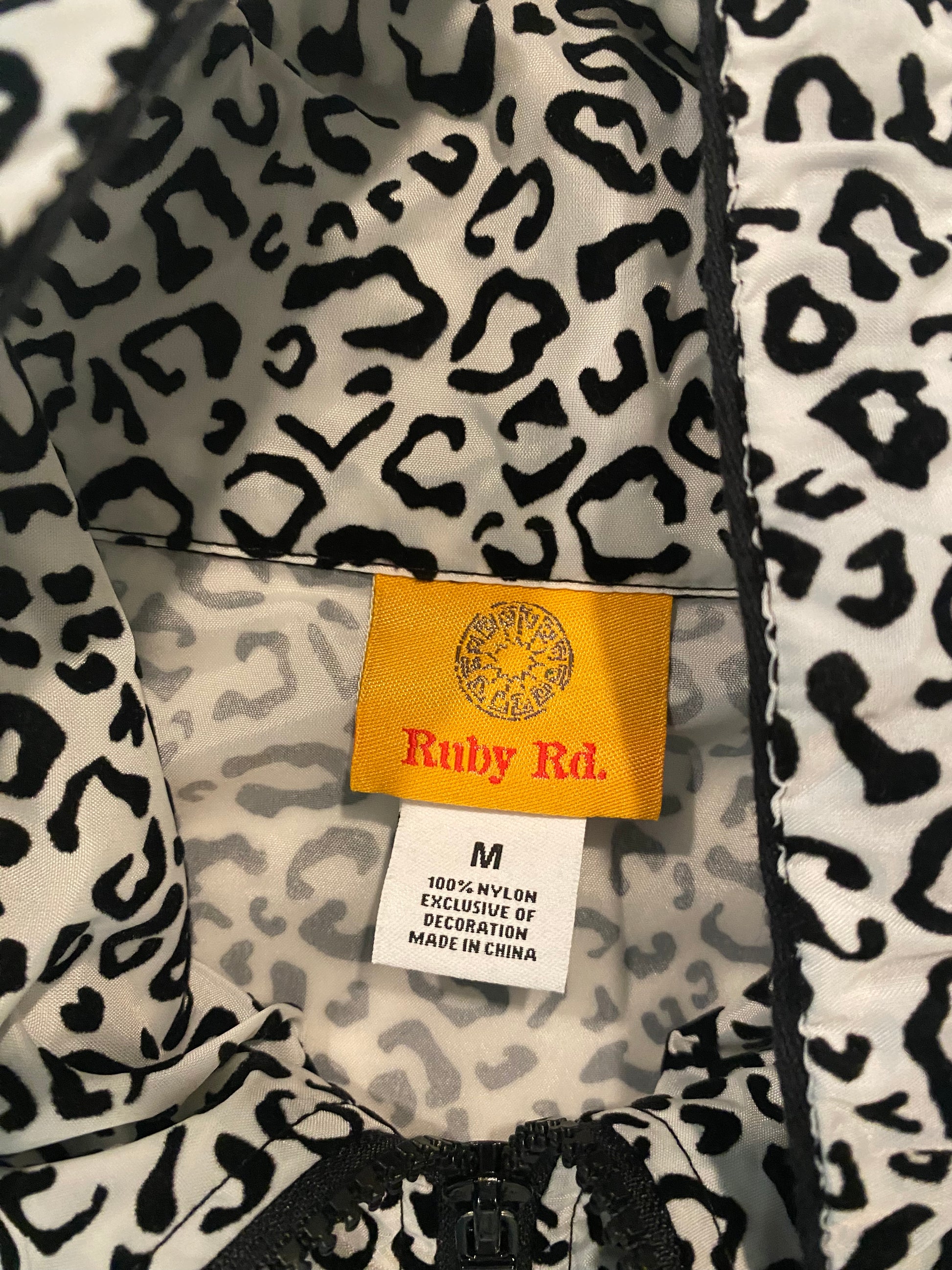 Ruby Red Black & White Leopard Print Windbreaker JacketRuby Red Black & White Leopard Print Windbreaker Jacket Not only is this jacket light weight and very functional, but it has style too! Look fantastic while keep