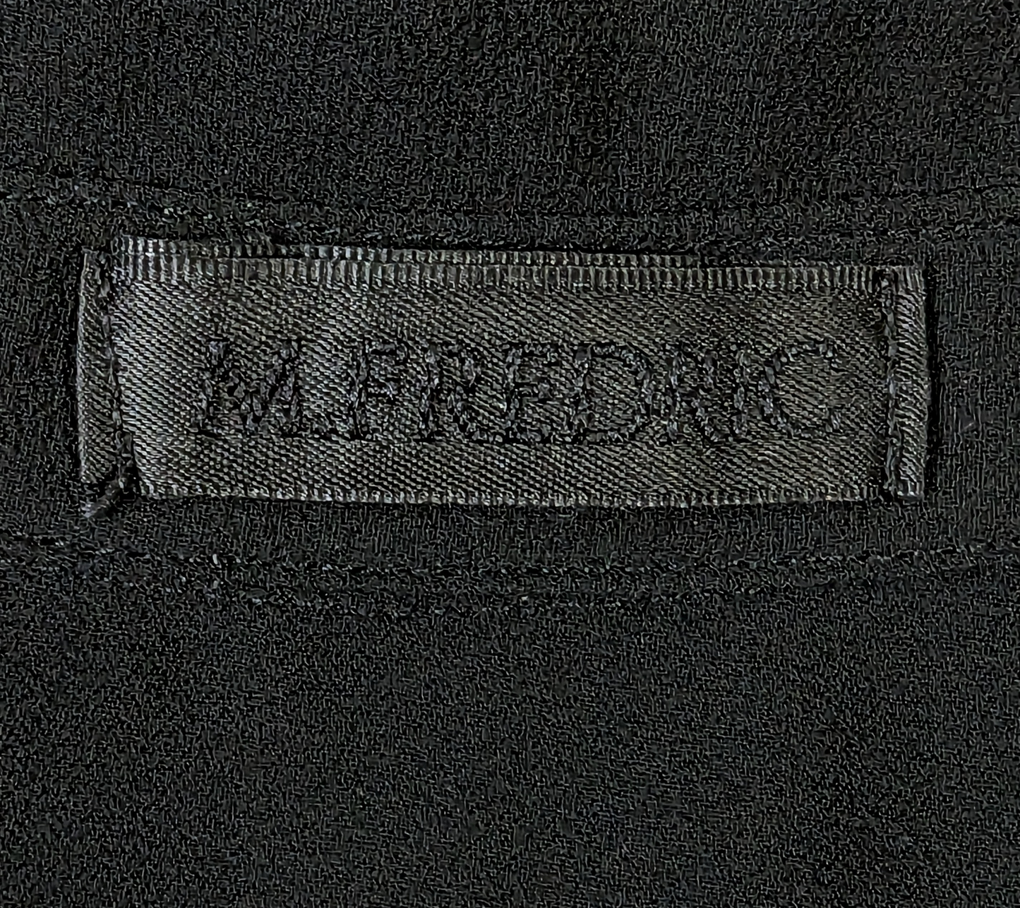 M. FredricThis M. Fredric sheer black blouse is the perfect choice for elegant style. Crafted from a lightweight fabric, the 3/4 length sleeves can be turned up with a button BlouseM. Fredric Sheer Black BlouseFredric Sheer Black Blouse