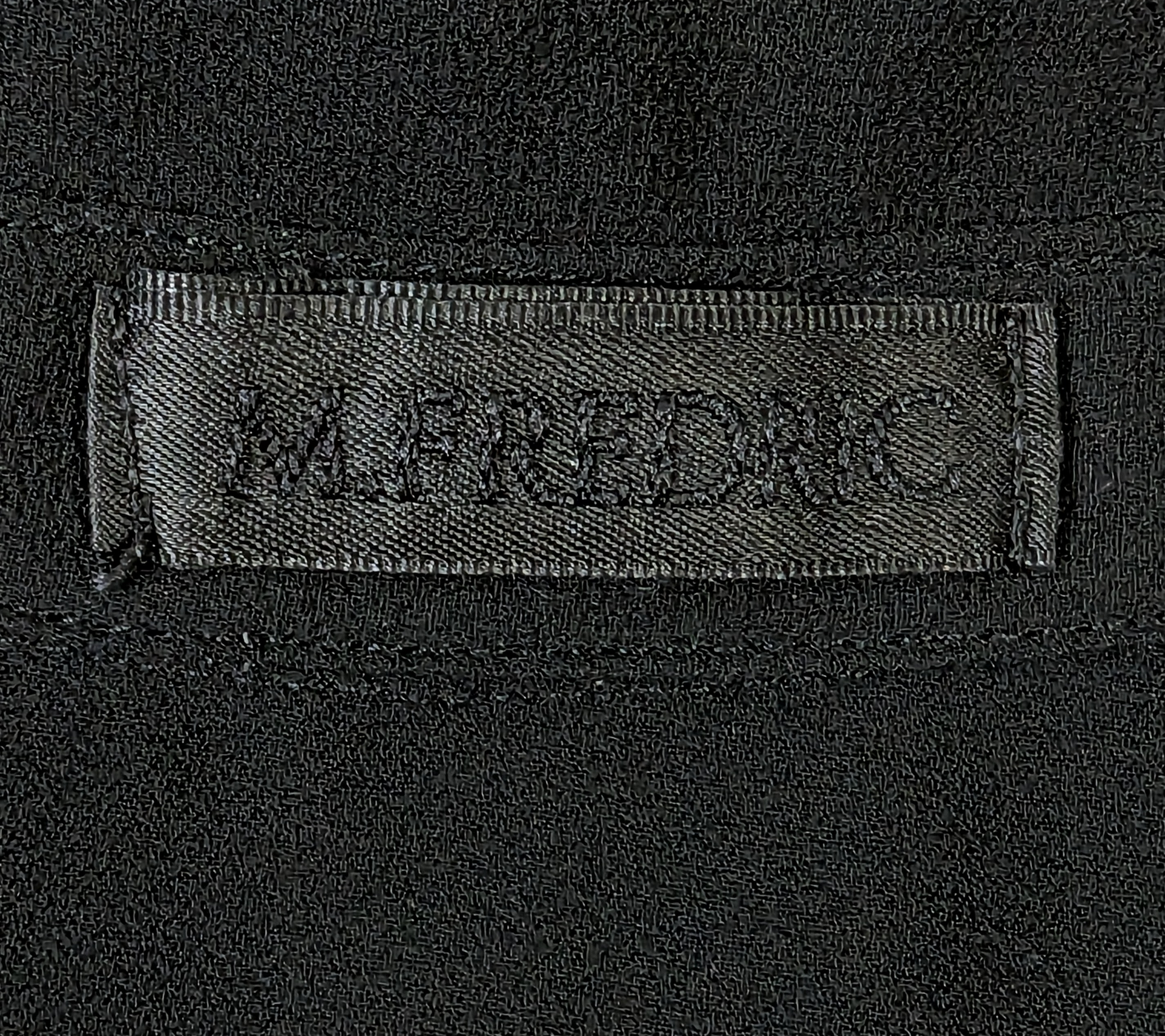 M. FredricThis M. Fredric sheer black blouse is the perfect choice for elegant style. Crafted from a lightweight fabric, the 3/4 length sleeves can be turned up with a button BlouseM. Fredric Sheer Black BlouseFredric Sheer Black Blouse