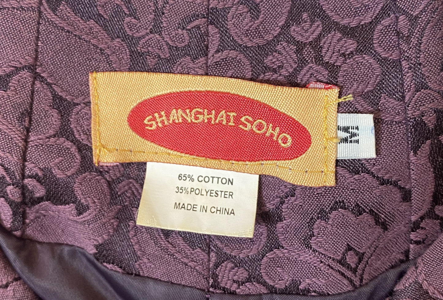 Shanghai Soho Plum Brocade Jacket Stunning plum colored brocade jacket with cuffed sleeves and frog closures.