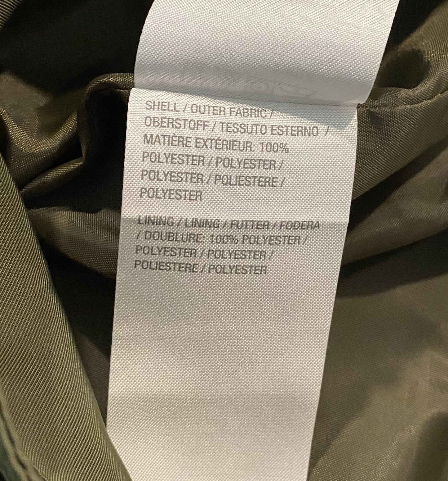 Isaac Mizrahi Live! Women's SOHO Hooded Olive Green Rain Jacket This rain jacket has such great styling. Along with a hood and pockets, it zips & snaps up the front to ensure keeping the chill out.