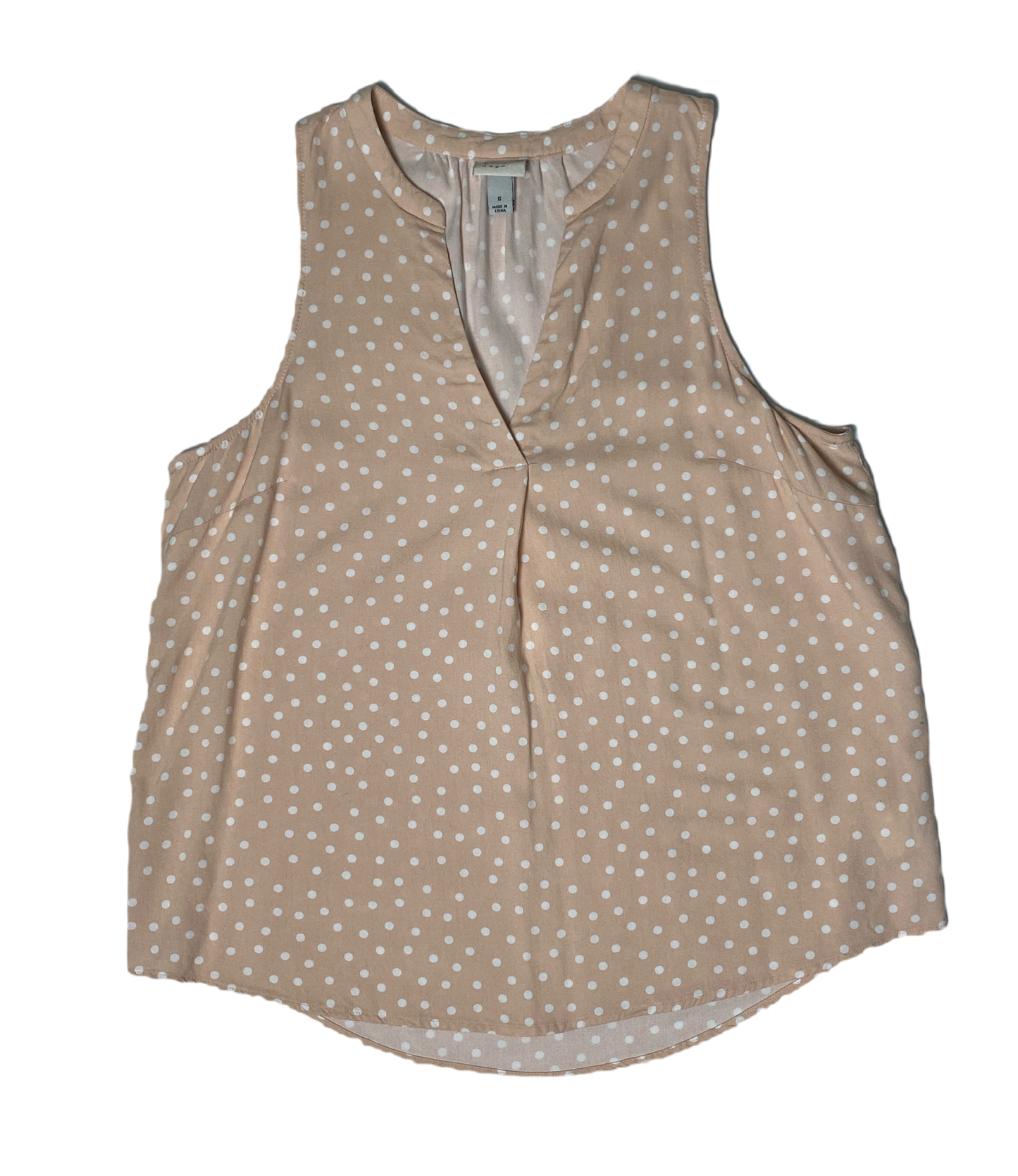 A New Day Sleeveless Blush Polka Dot Shirt  Embrace the whimsy of A New Day. This playful polka dot shirt features a flattering V neck and sleeveless design, perfect