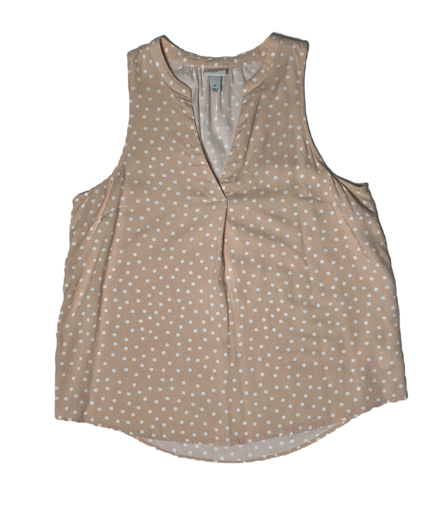 A New Day Sleeveless Blush Polka Dot Shirt  Embrace the whimsy of A New Day. This playful polka dot shirt features a flattering V neck and sleeveless design, perfect