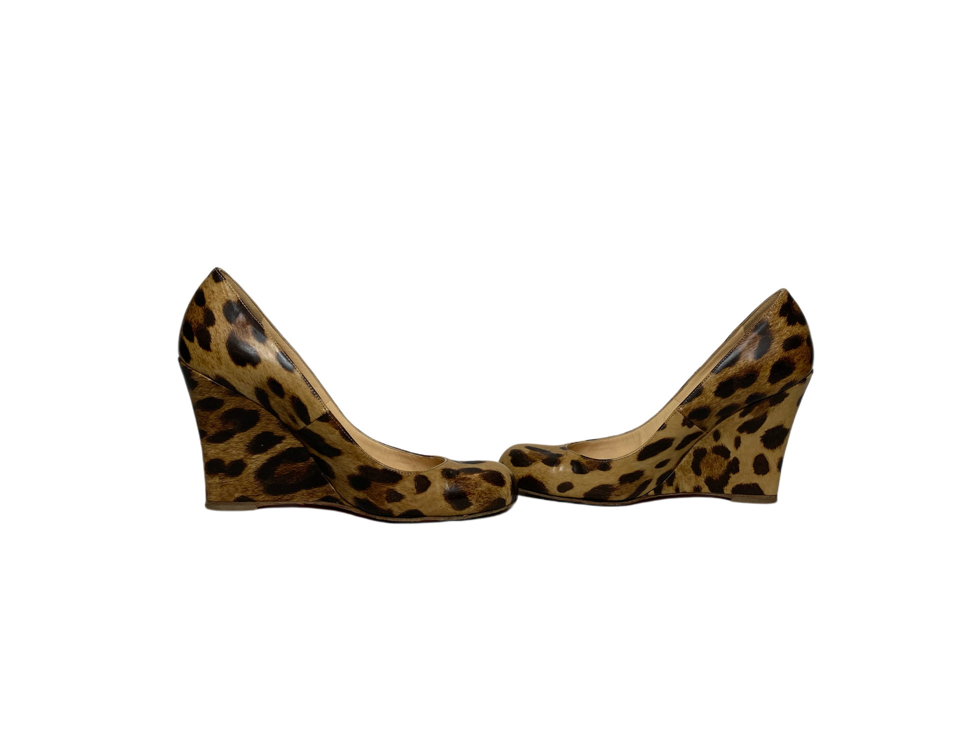 These Christian Louboutin Leopard Print Patent Leather Wedges are worn, but still look amazing!! The bottom shows most of the wear. Box and cloth bag included.
The i