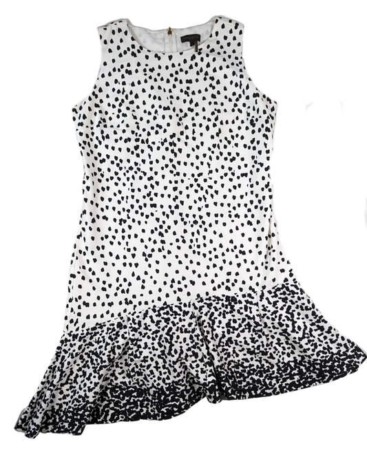 Donna Karan Sleeveless Black and White Dress with Polka Dots and Asymmetrical Hem.A painterly Dalmatian dot print patterns this sleeveless dress, with an ombré dot finish and asymmetric hemline adding flair to the silhouette. Round neck,  sleeveleDonna Karan White DressDresses