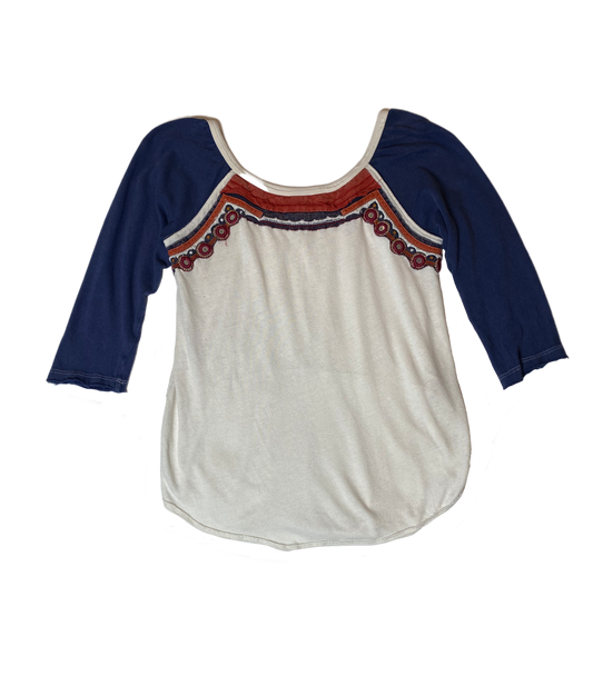 Free People Raglan Sleeve T-Shirt with Crochet Trim Size Small Step out in style with the Free People Raglan Sleeve T-Shirt! This playful top features raglan sleeves