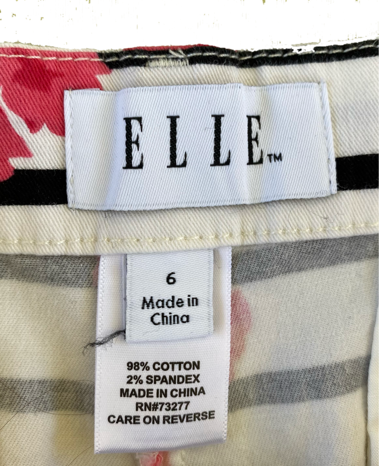 ELLE White Printed Shorts with black stripes, pink flowers and side po