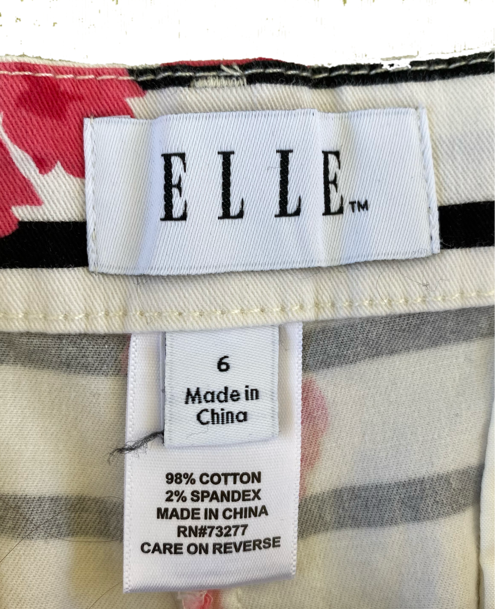 ELLE White Printed Shorts with black stripes, pink flowers and side po