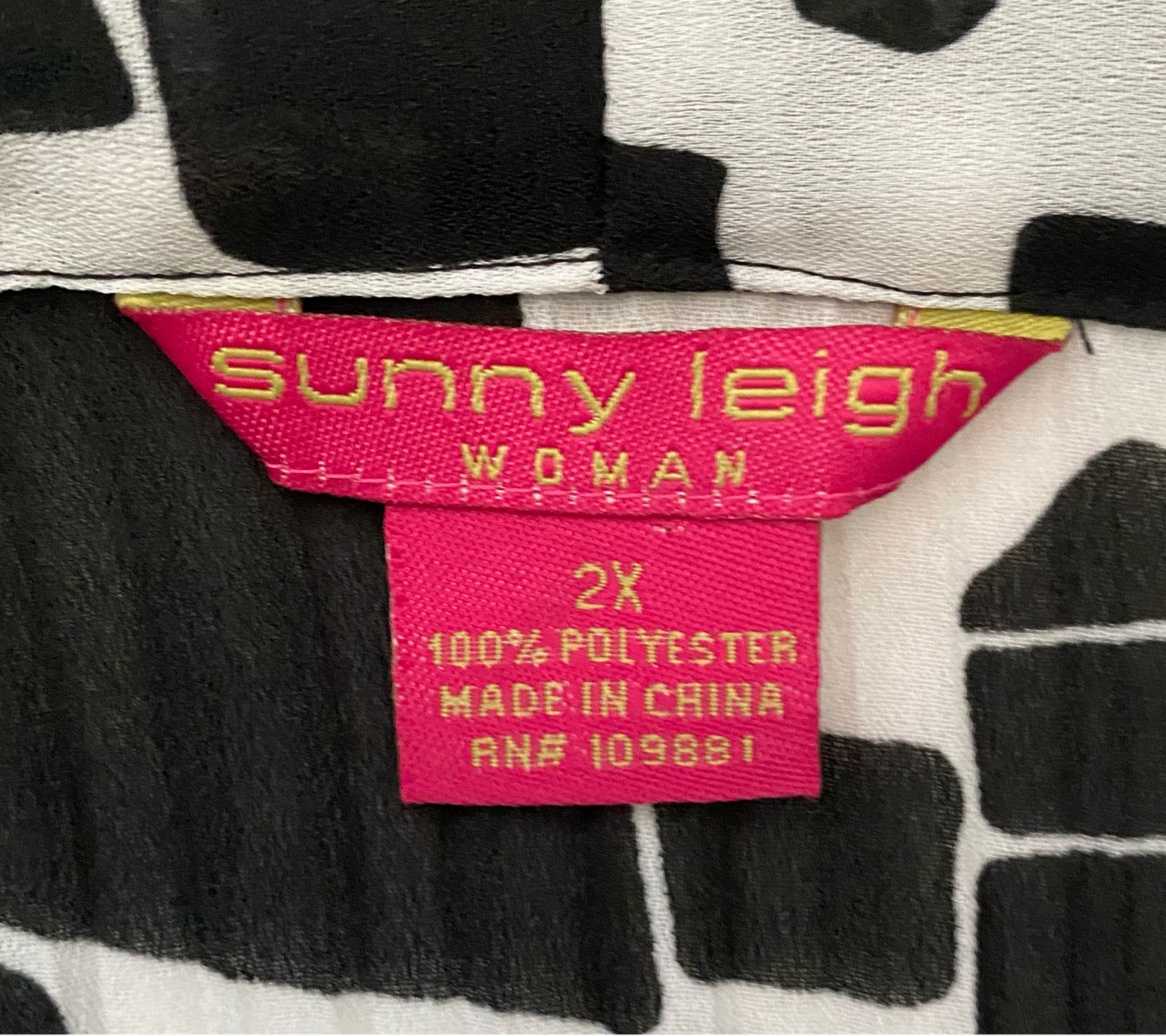 Sunny Leigh Womens black and white blouse a striking fusion of profess