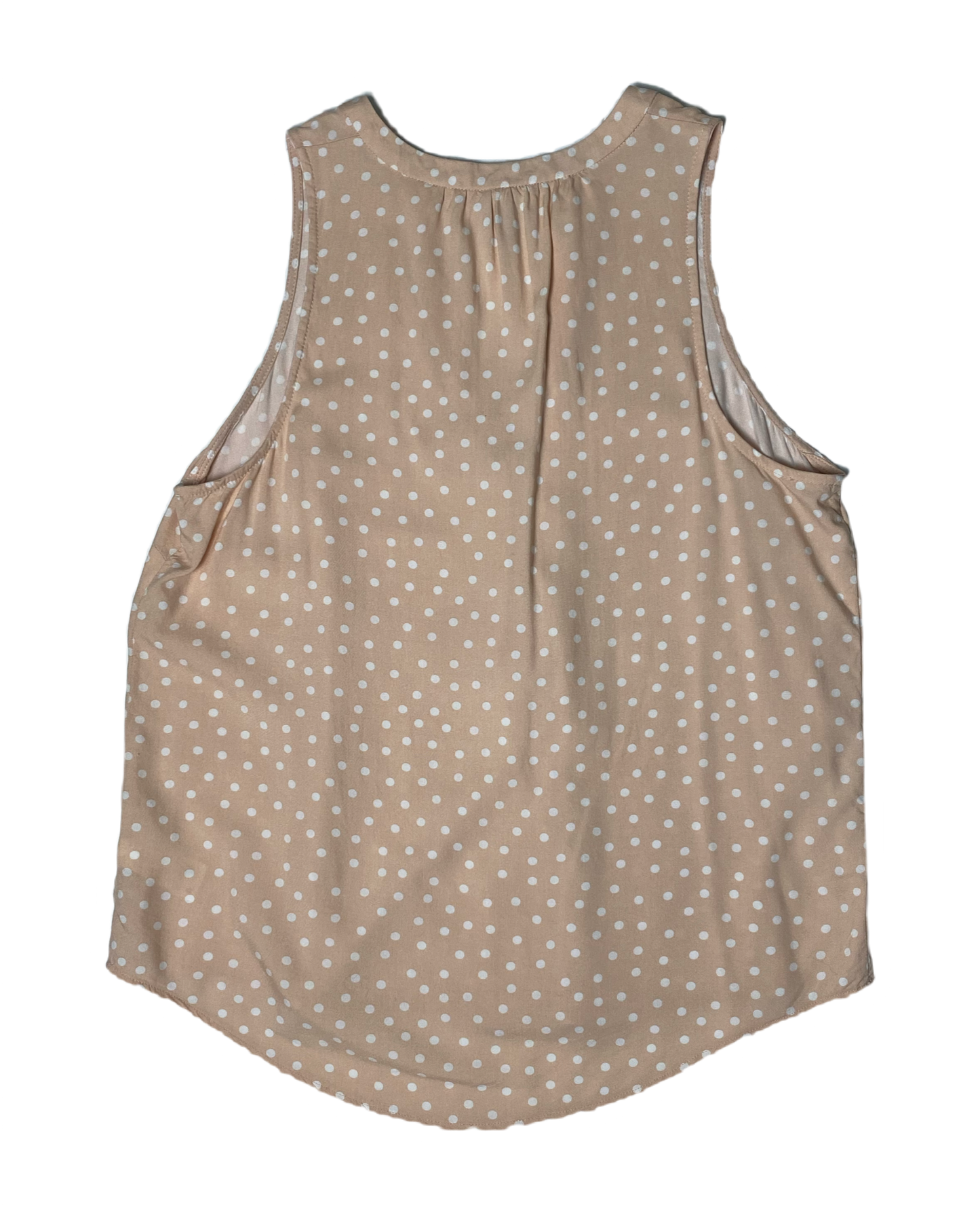 A New Day Sleeveless Blush Polka Dot Shirt  Embrace the whimsy of A New Day. This playful polka dot shirt features a flattering V neck and sleeveless design, perfect