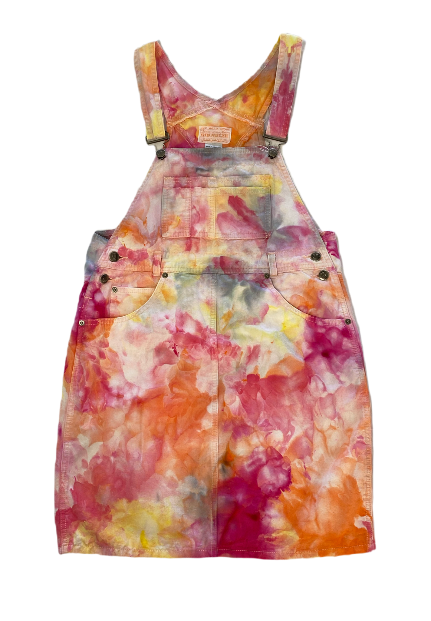 REFRESHED - Squeeze Canvas Skirt Overalls  Get ready to squeeze into style with our REFRESHED Squeeze Canvas Skirt Overalls. Hand dyed with a bright and playful mix