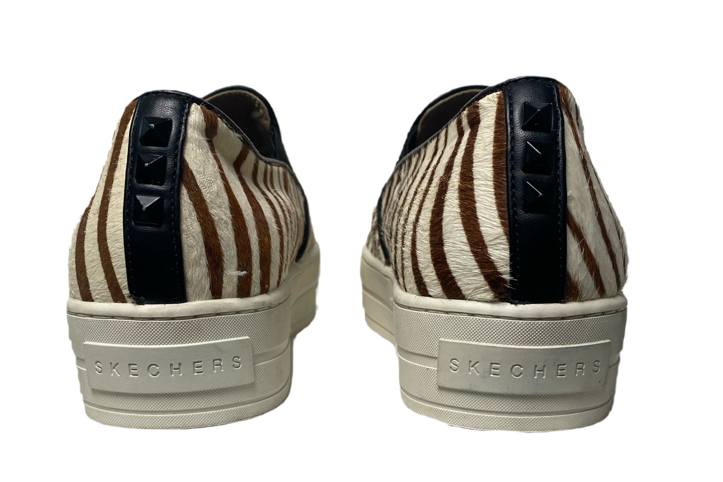 Sketchers Street Rise Fit Zebra Stripe Sneakers Get ready to roar with these Sketchers Street Rise Fit Zebra Stripe Sneakers! With their playful zebra print and perf