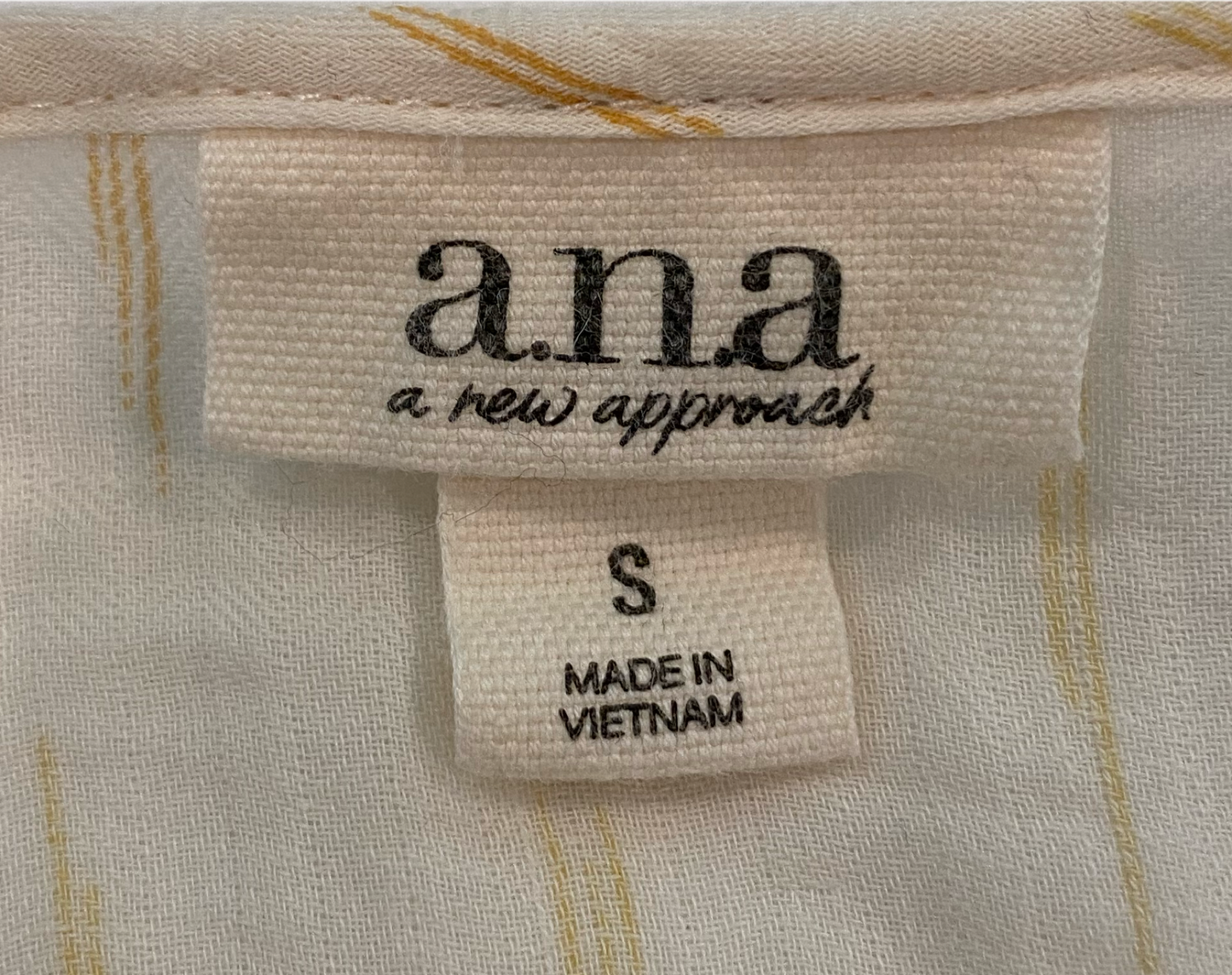 ana Cream Peasant Style 3/4 Sleeve Print Blouse Add a touch of bohemian charm to your wardrobe with a.n.a.'s Cream Peasant Style Blouse. Featuring a subtle tan pr
