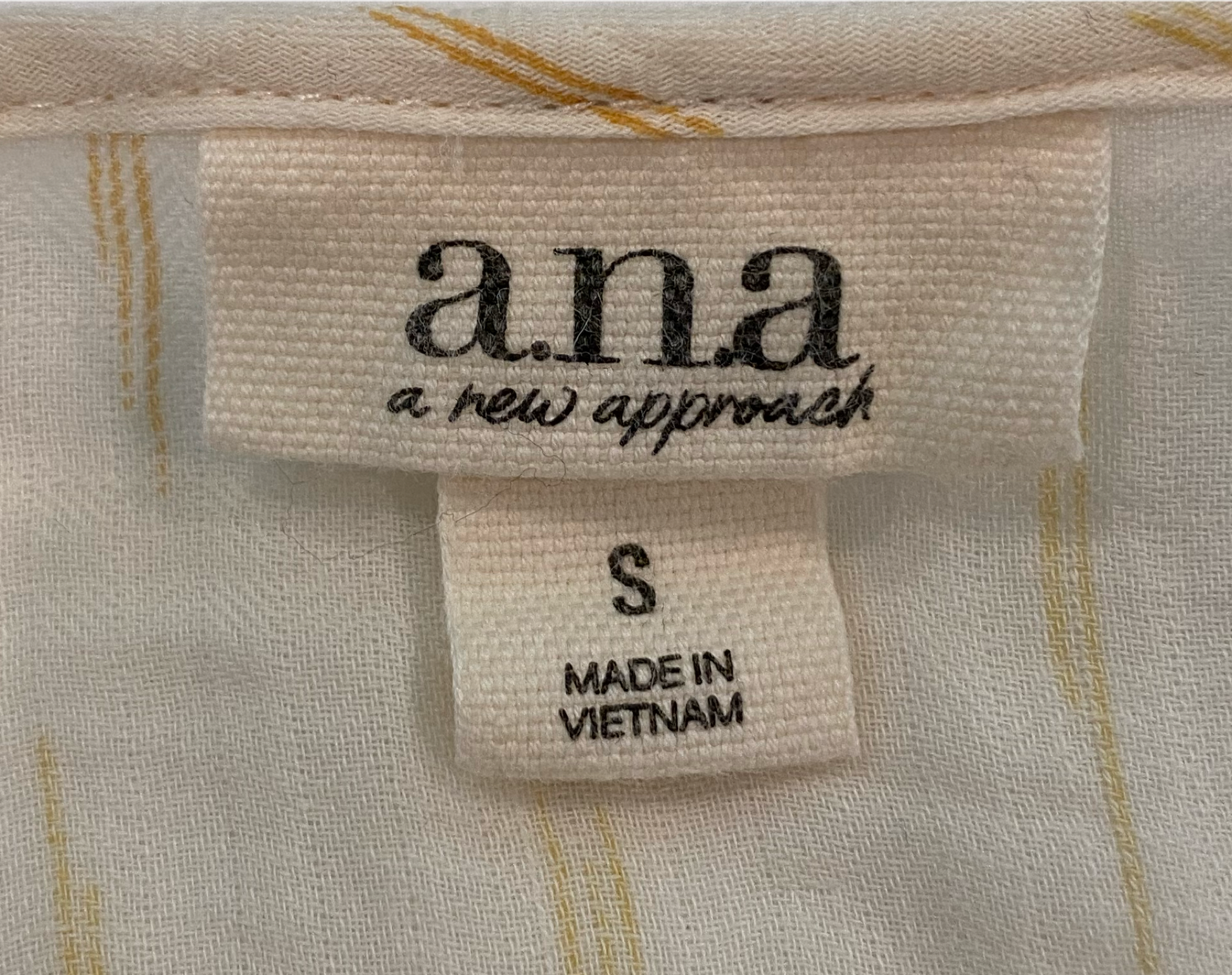 ana Cream Peasant Style 3/4 Sleeve Print Blouse Add a touch of bohemian charm to your wardrobe with a.n.a.'s Cream Peasant Style Blouse. Featuring a subtle tan pr