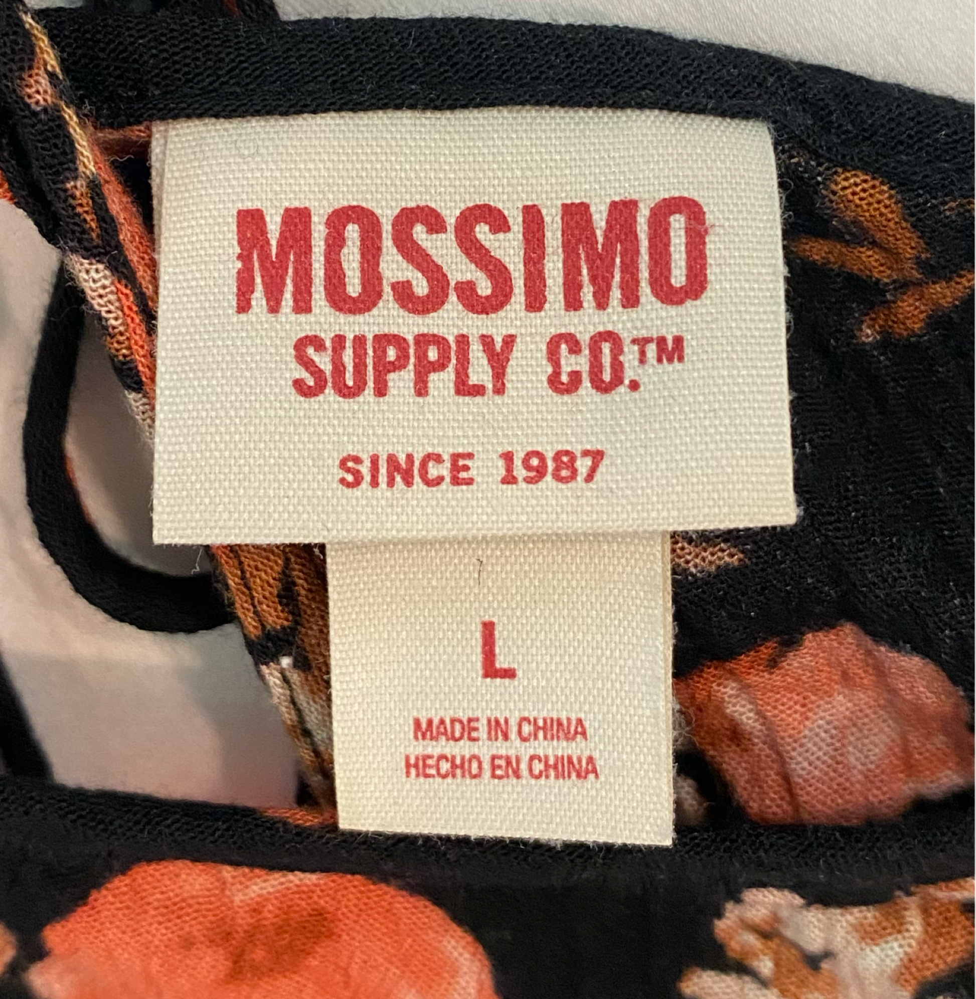 Mossimo Black Floral Print BlouseMossimo Supply Co black floral print top with hater type neck and cold shoulder sleeves.
Pair this with denim shorts and black sandals for a beach day with friends!