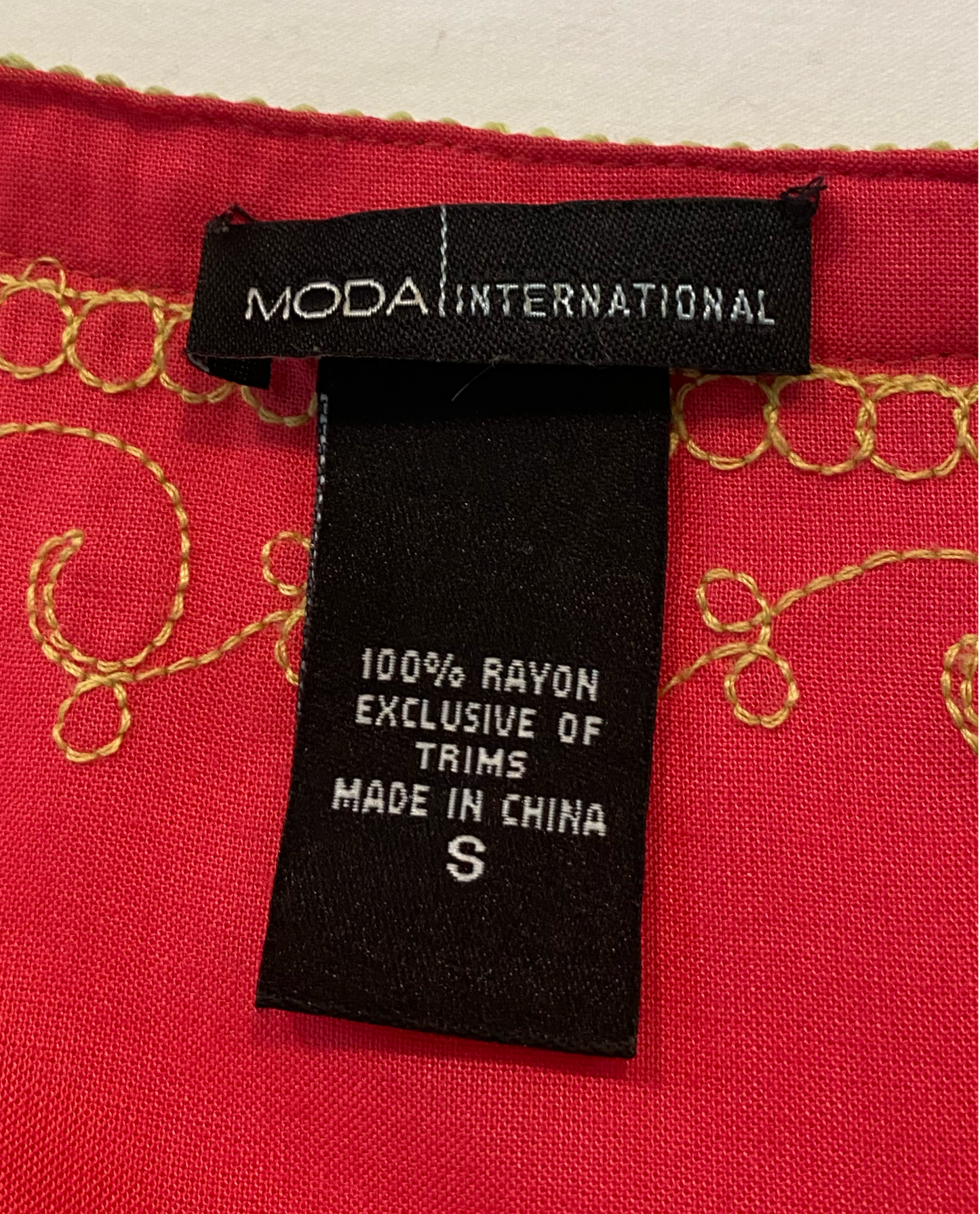 Moda International Embroidered Detail DressModa International embroidered detail dress with long sleeves and a ruffle hem.