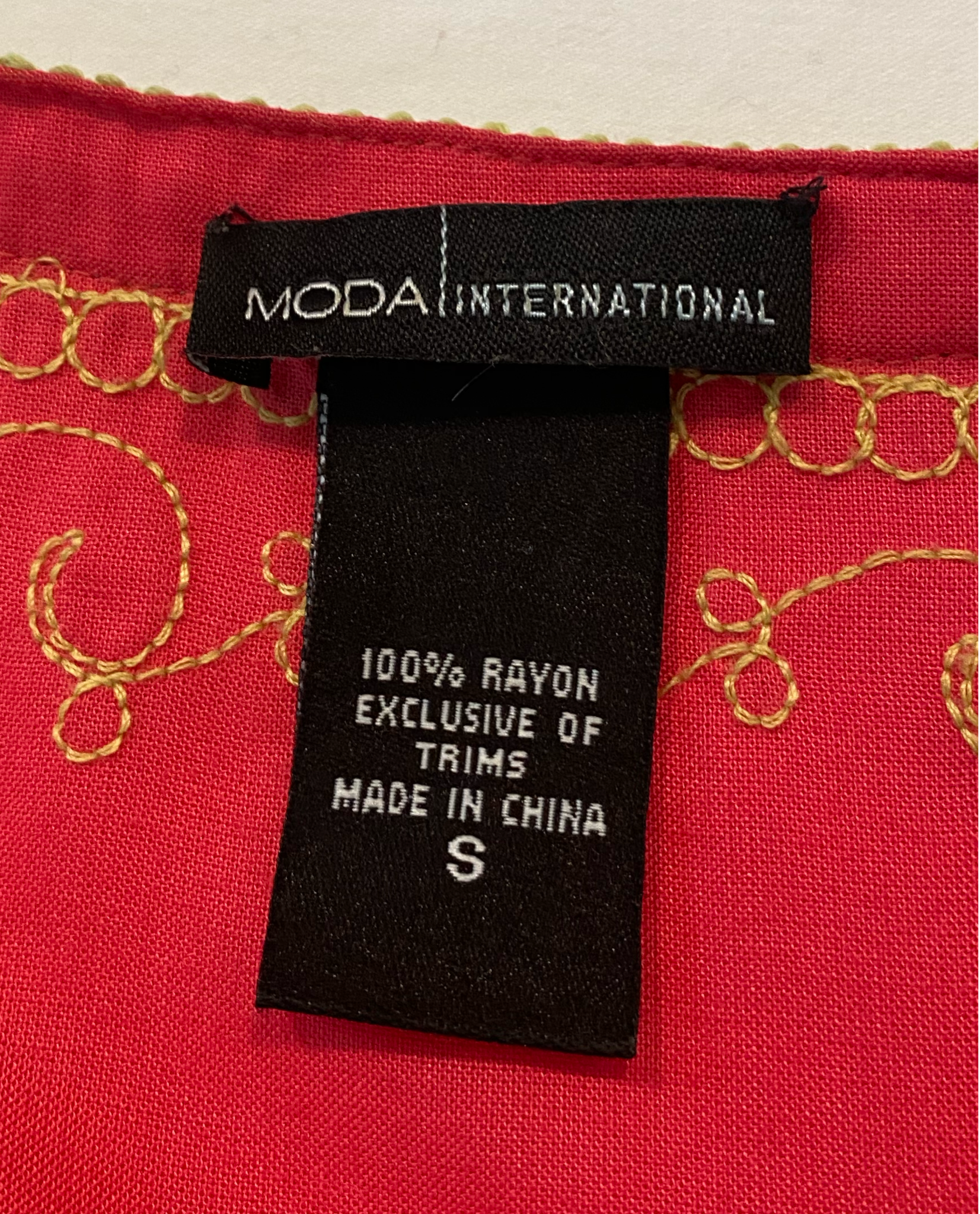 Moda International Embroidered Detail DressModa International embroidered detail dress with long sleeves and a ruffle hem.