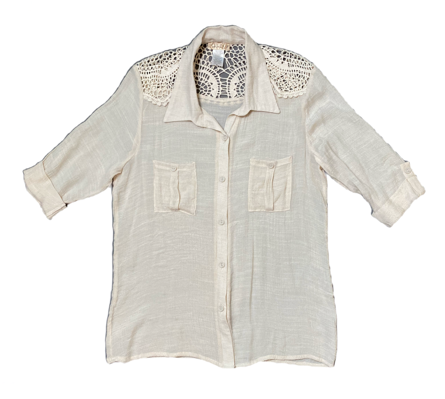 Lavish Cream Blouse with Crochet Accent.Lavish Cream button front blouse with crochet accent. Roll up sleeves and front pockets.