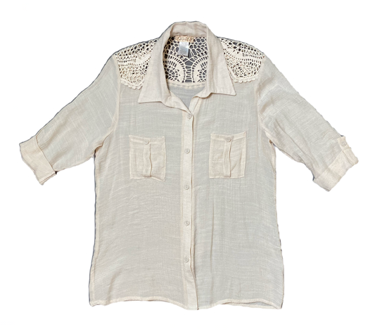 Lavish Cream Blouse with Crochet Accent.Lavish Cream button front blouse with crochet accent. Roll up sleeves and front pockets.