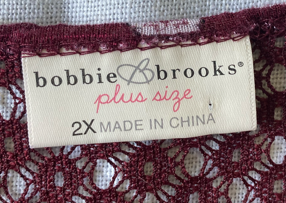 Bobbie Brooks Short Sleeve Crochet-neck Top Size 2x  Add a touch of fun to your wardrobe with the Bobbie Brooks Short Sleeve Crochet-neck Top! This playful top featu