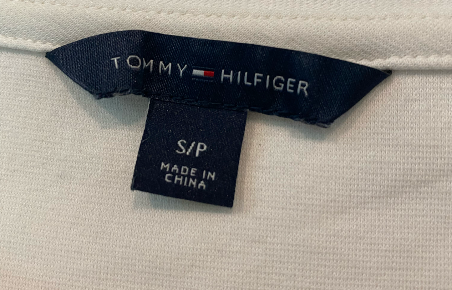 Tommy Hilfiger Striped Printed Top  Elevate your style with the Tommy Hilfiger Striped Printed Top. Made by the iconic fashion brand, this top features bold stripes