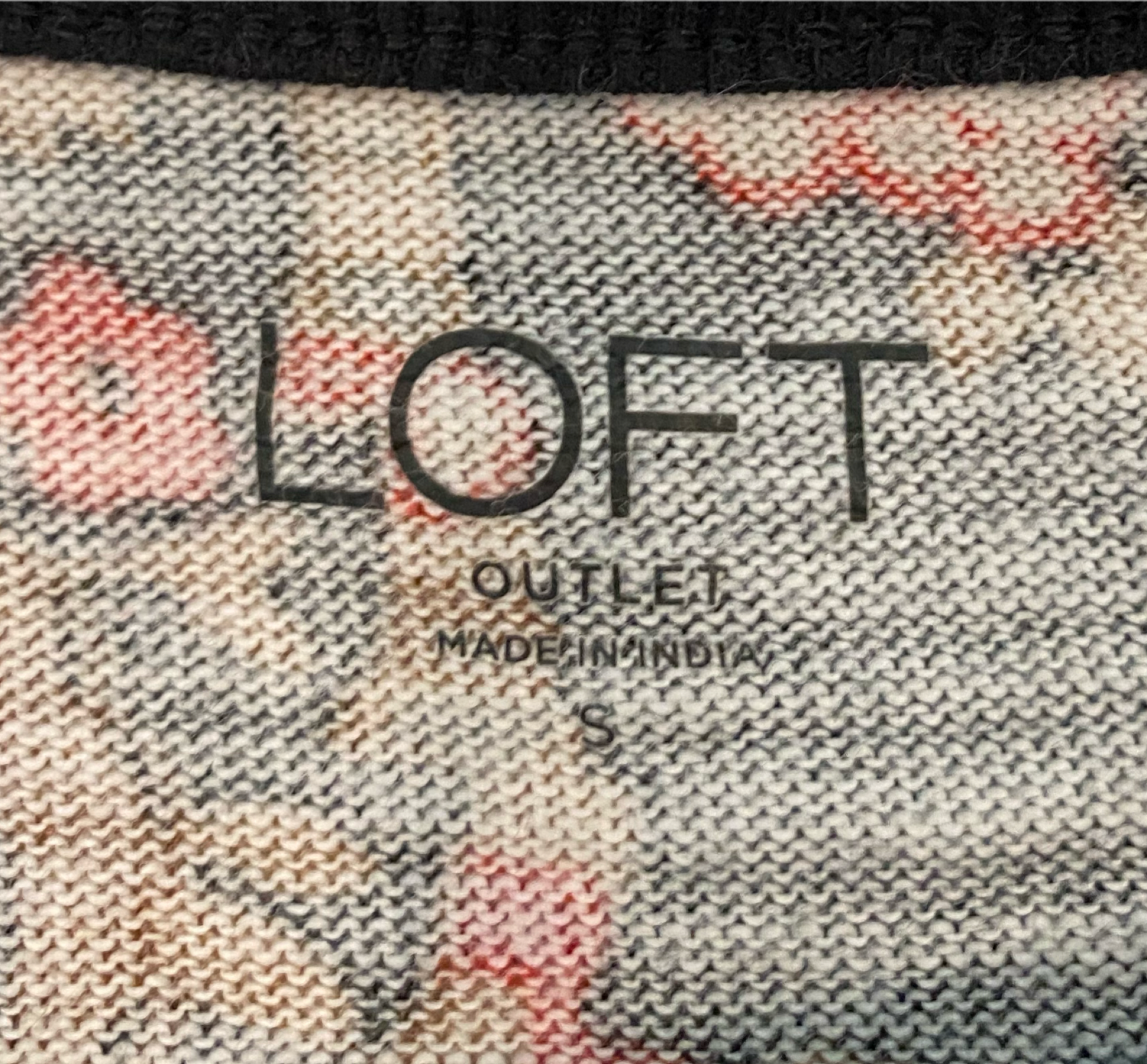 Loft Outlet Paisley Print Knit TopBlack knit top with red, cream and green paisley print. Long sleeves with banded cuff. Added little ruffle detail at the arm seam.