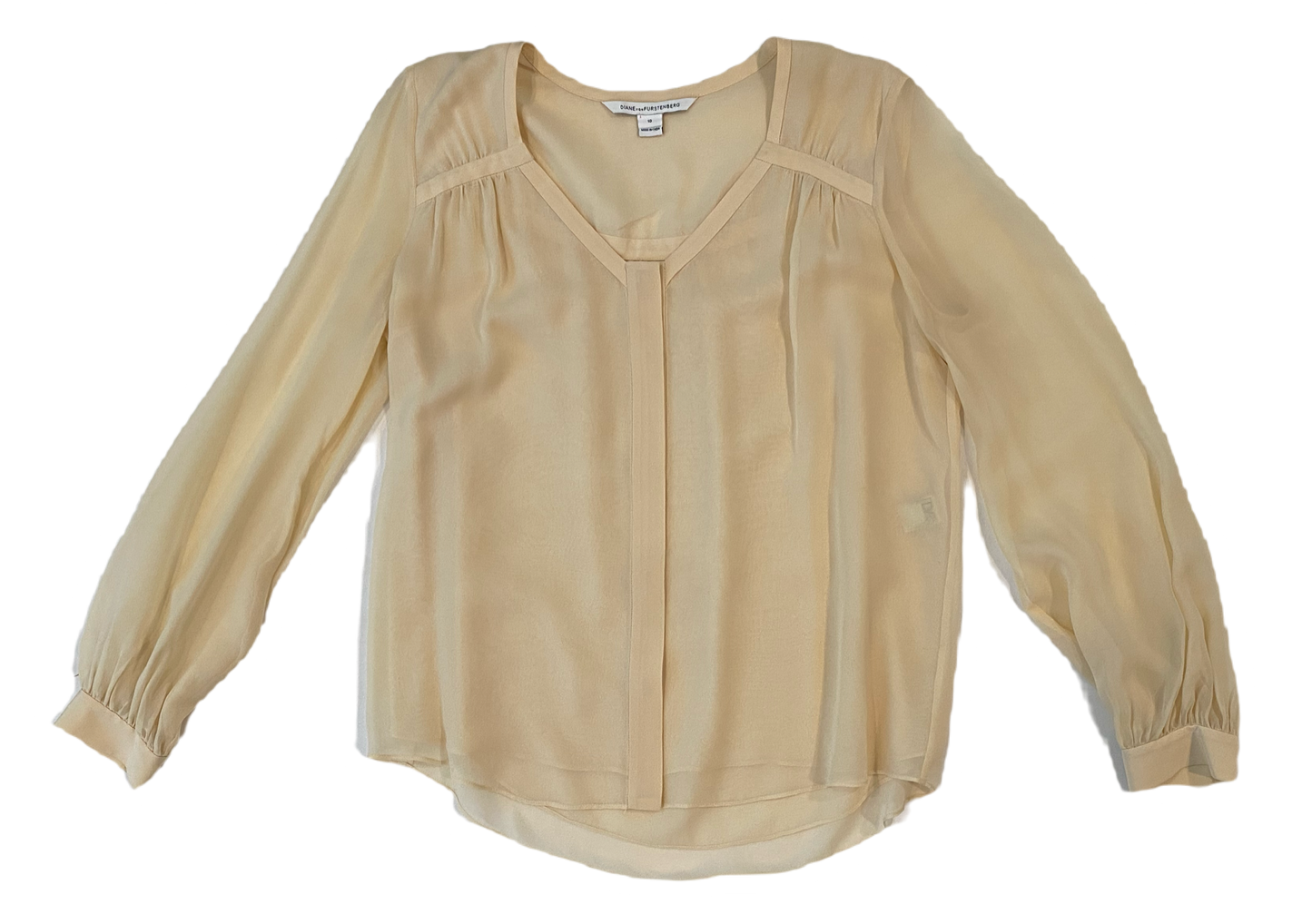 Diane Von Furstenberg Long Sleeve Silk Cream BlouseDVF sheer silk lined cream blouse with long sleeves and band detail at neck line. Hidden button front and button cuffs. 
This timeless blouse can easily be dressed u