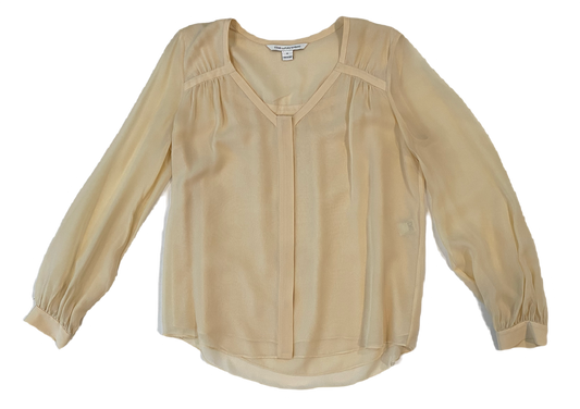 Diane Von Furstenberg Long Sleeve Silk Cream BlouseDVF sheer silk lined cream blouse with long sleeves and band detail at neck line. Hidden button front and button cuffs. 
This timeless blouse can easily be dressed u