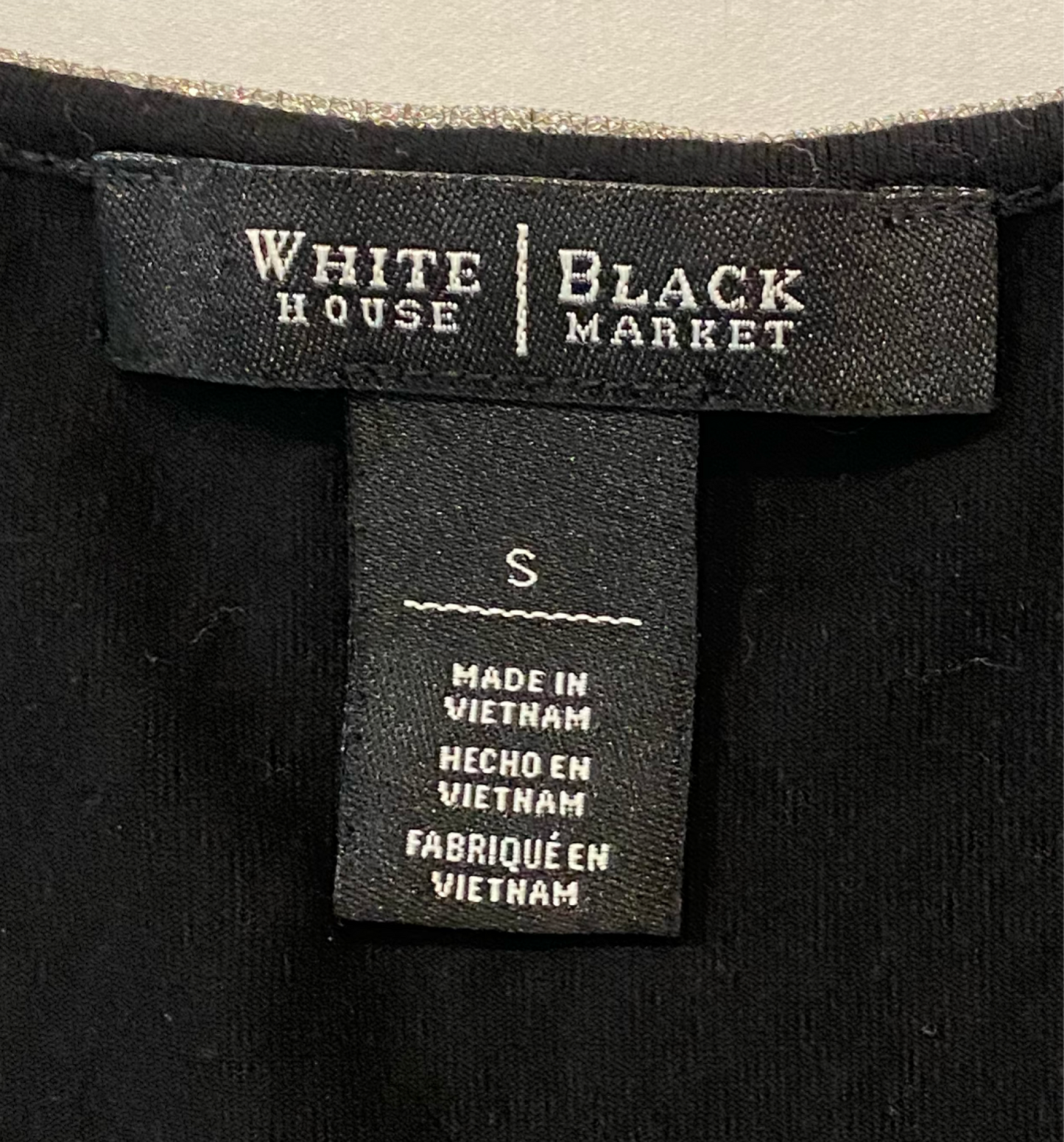 White House Black Market Black Jersey Tank Top with Beaded NecklineWHBM black jersey tank top with gathered sides and beaded neckline.
This cute top will quickly become a "go to" in your closet!!