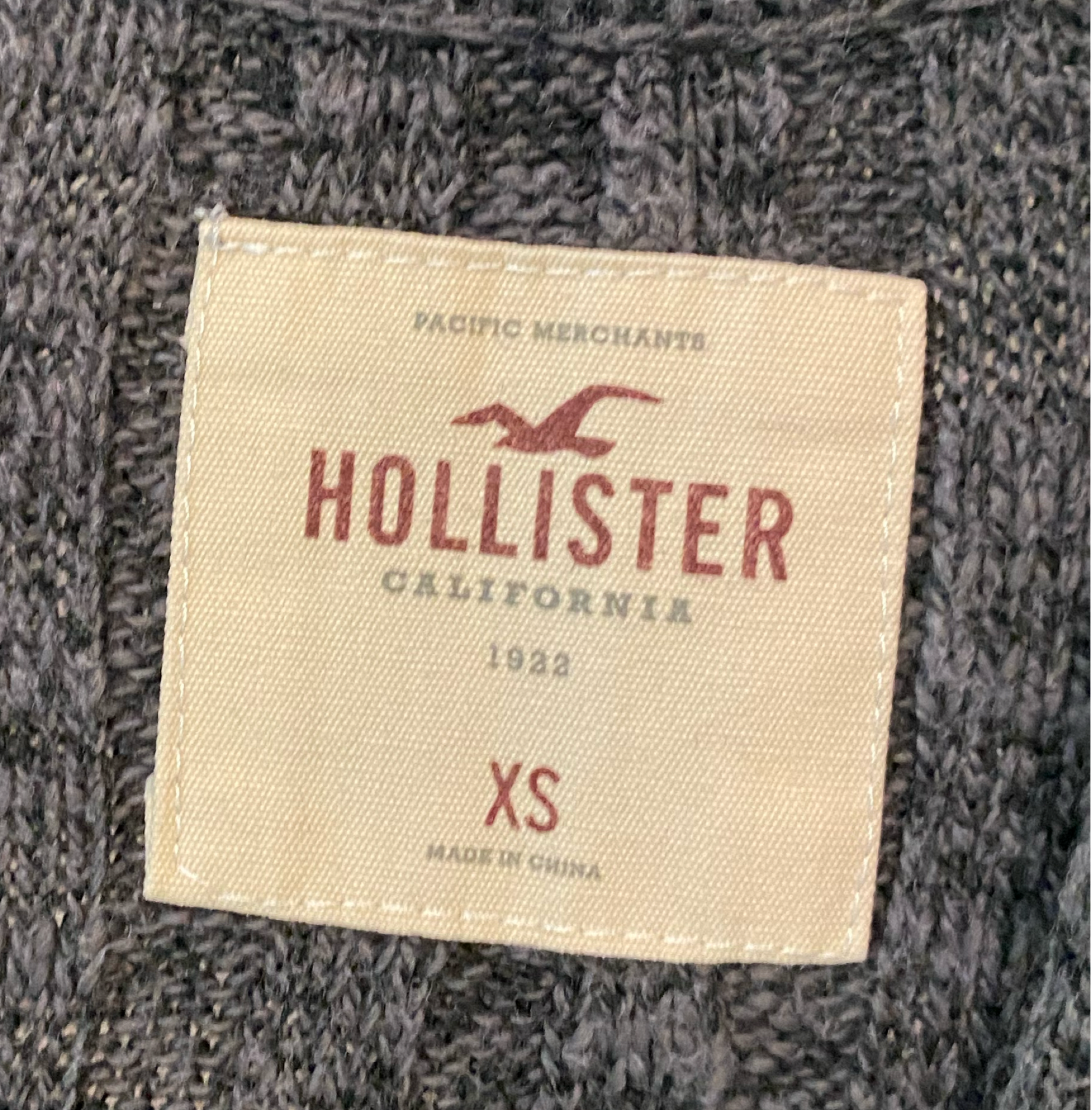 Hollister Long Grey Knit Cardigan Long grey knit open cardigan with white stripes and pockets.