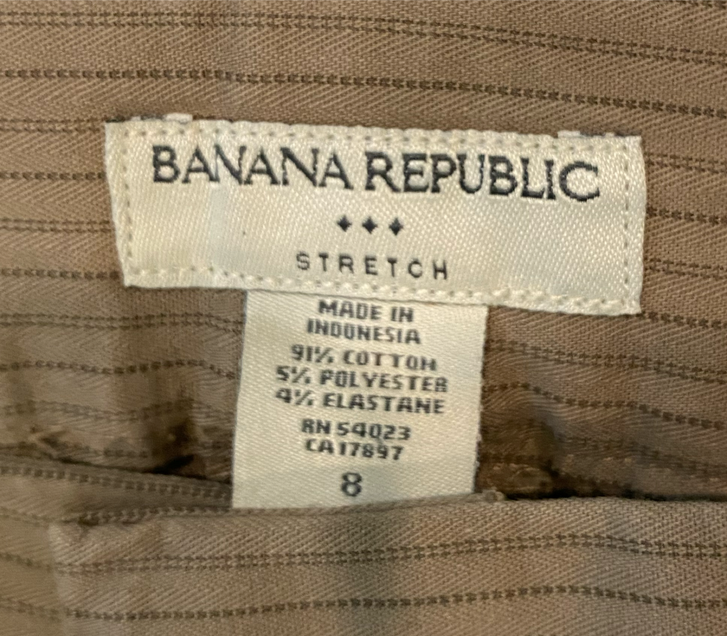 Banana Republic Tan Striped Pant Tan pant with thin brown stripes. Slit front and back pockets, wide leg and cuffed hem.
