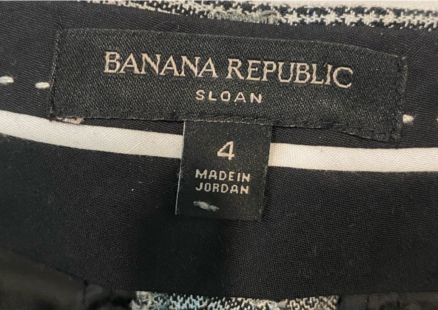 Banana Republic "Sloan" Plaid PantBlack, white & red plaid pants with front and back slit pockets.
Wear these to the office with black flats, then change into chunky heels and you are ready for a
