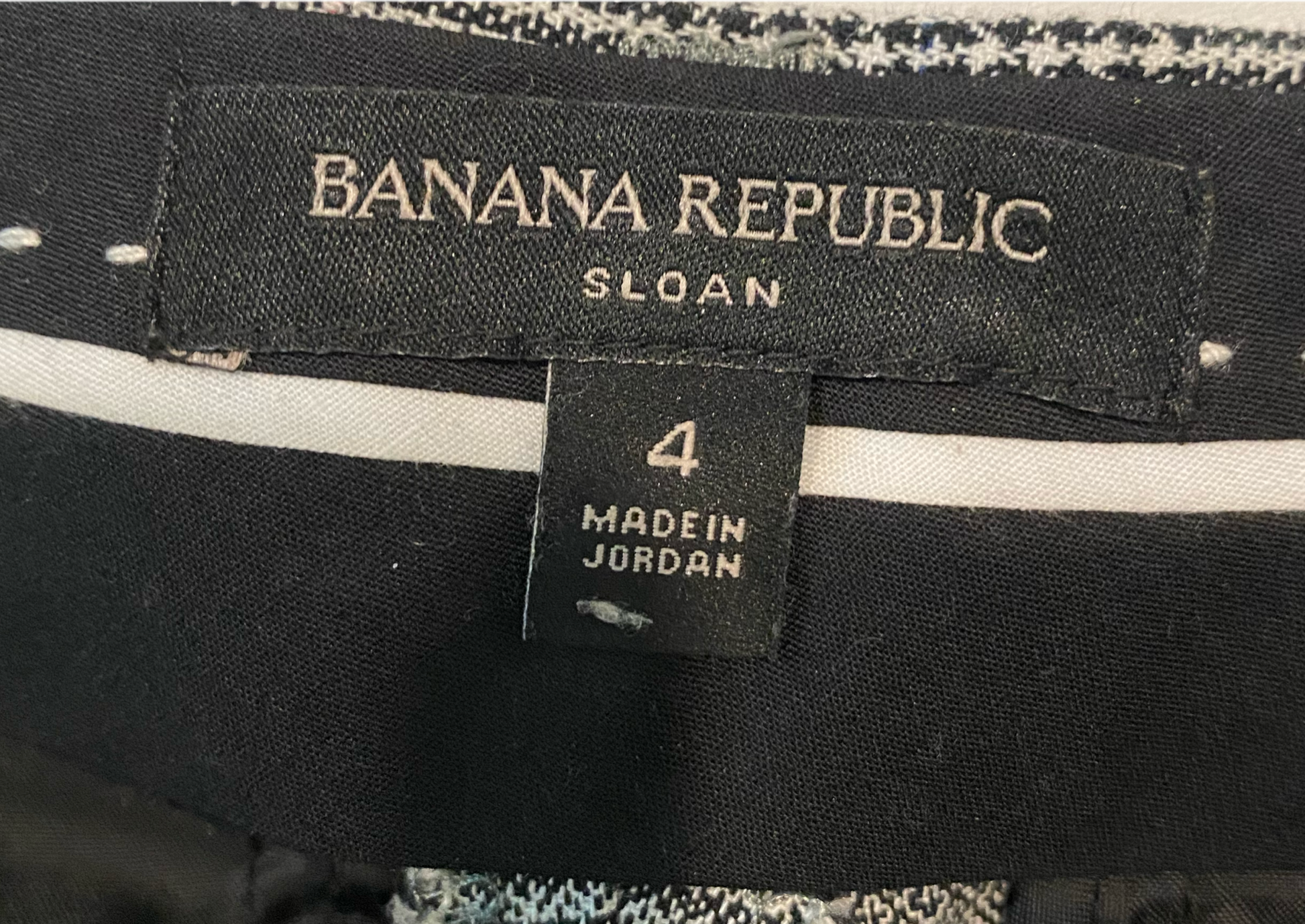 Banana Republic "Sloan" Plaid PantBlack, white & red plaid pants with front and back slit pockets.
Wear these to the office with black flats, then change into chunky heels and you are ready for a