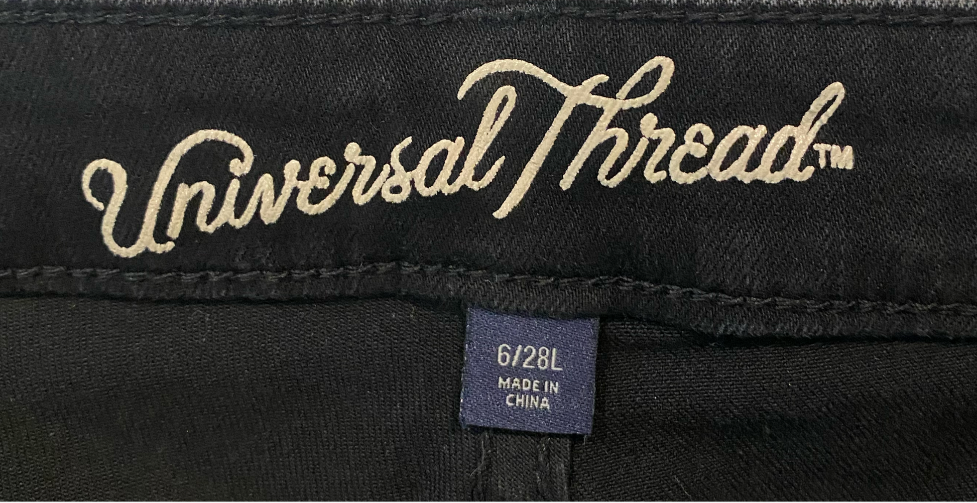 Universal Thread Distressed Jeans Distressed black denim jeans with pockets.