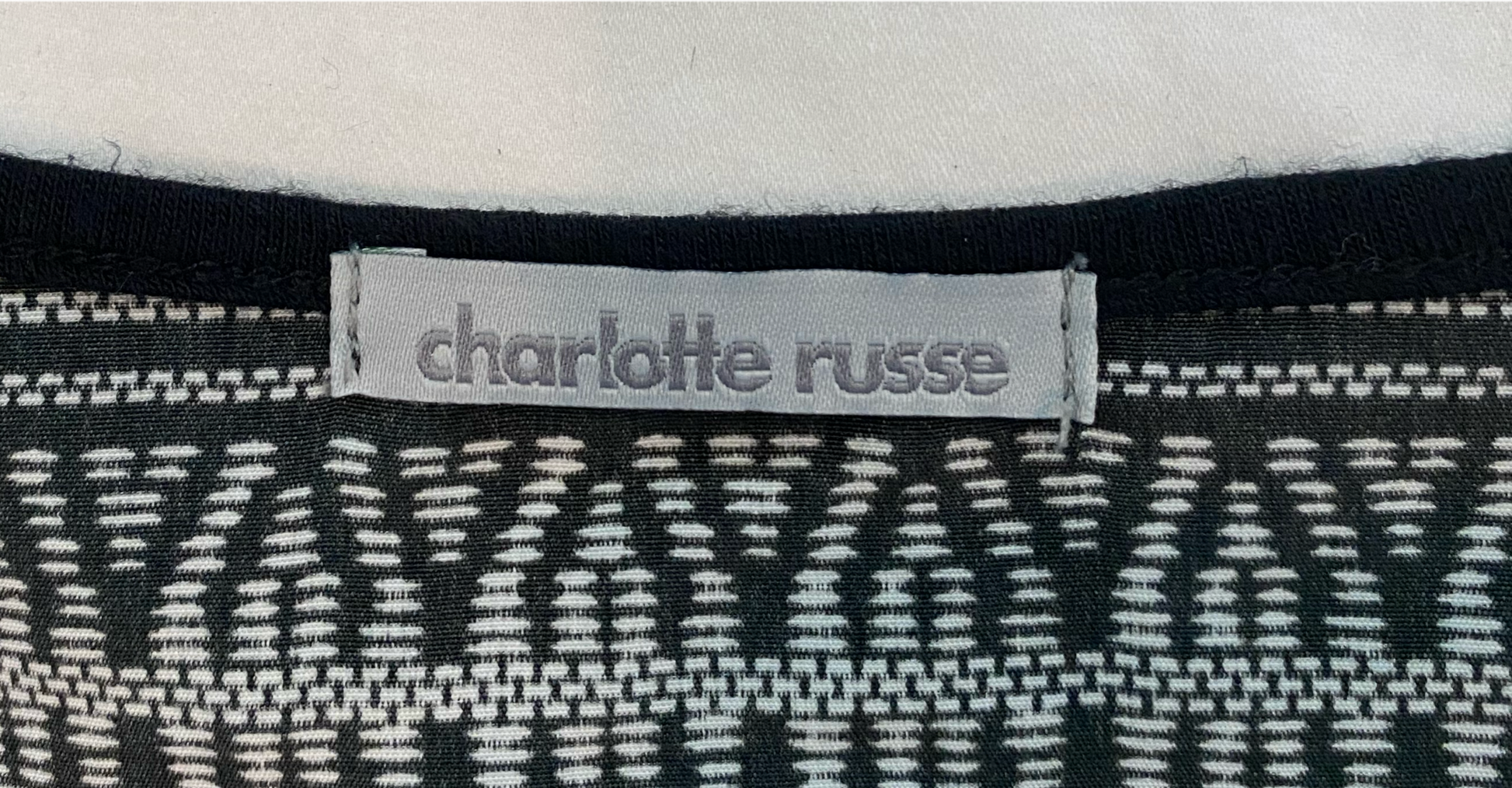 Charlotte Russe Printed Dolman Sleeve ShirtCharlotte Russe multi color printed center front and back shirt with dolman sleeves.