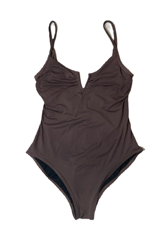 Vince Camuto Plum Colored One Piece Swim Suit Dive into playful elegance with the Vince Camuto One Piece Swim Suit. This unique plum colored suit features a deep V n