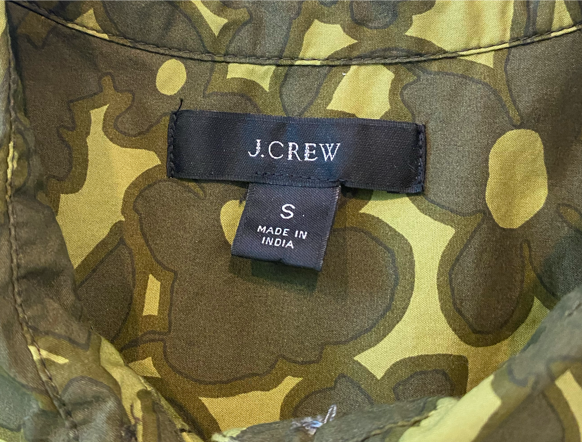 J Crew Floral Print Button Blouse Elevate your wardrobe with this abstract floral blouse from J Crew. Its vibrant green and chartreuse color is perfect for spring and summer. The button-down style an