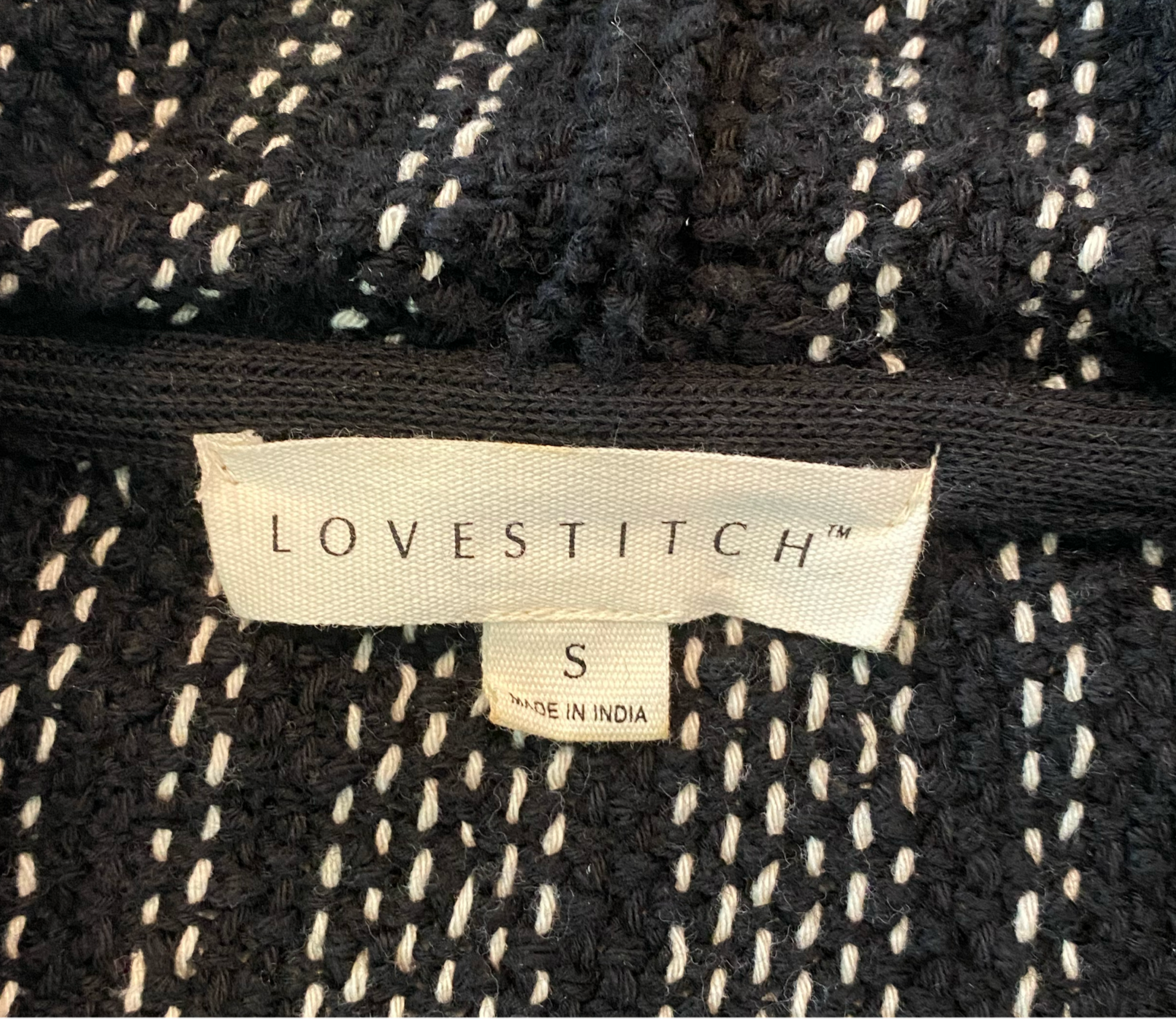 Lovestitch Black & White Hoodie Lovestitch baja style pullover black and white hoodie with long sleeves and front pocket. Stay cozy and stylish with this black and white pullover from Lovestitch. W