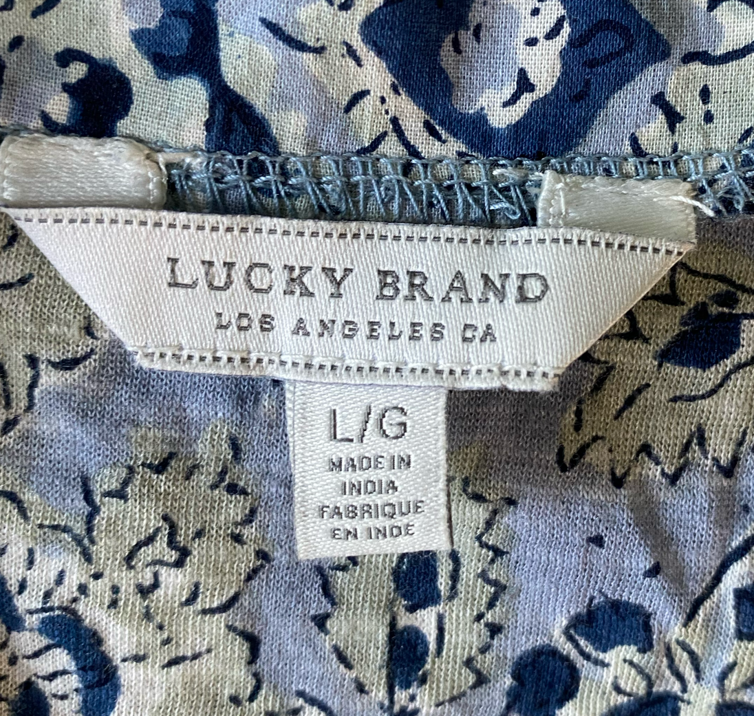 Lucky Brand Sleeveless Lace-up Print Top  Size L  Experience effortless style with the Lucky Brand Sleeveless Lace-up Print Top. The beautiful blue and green print w