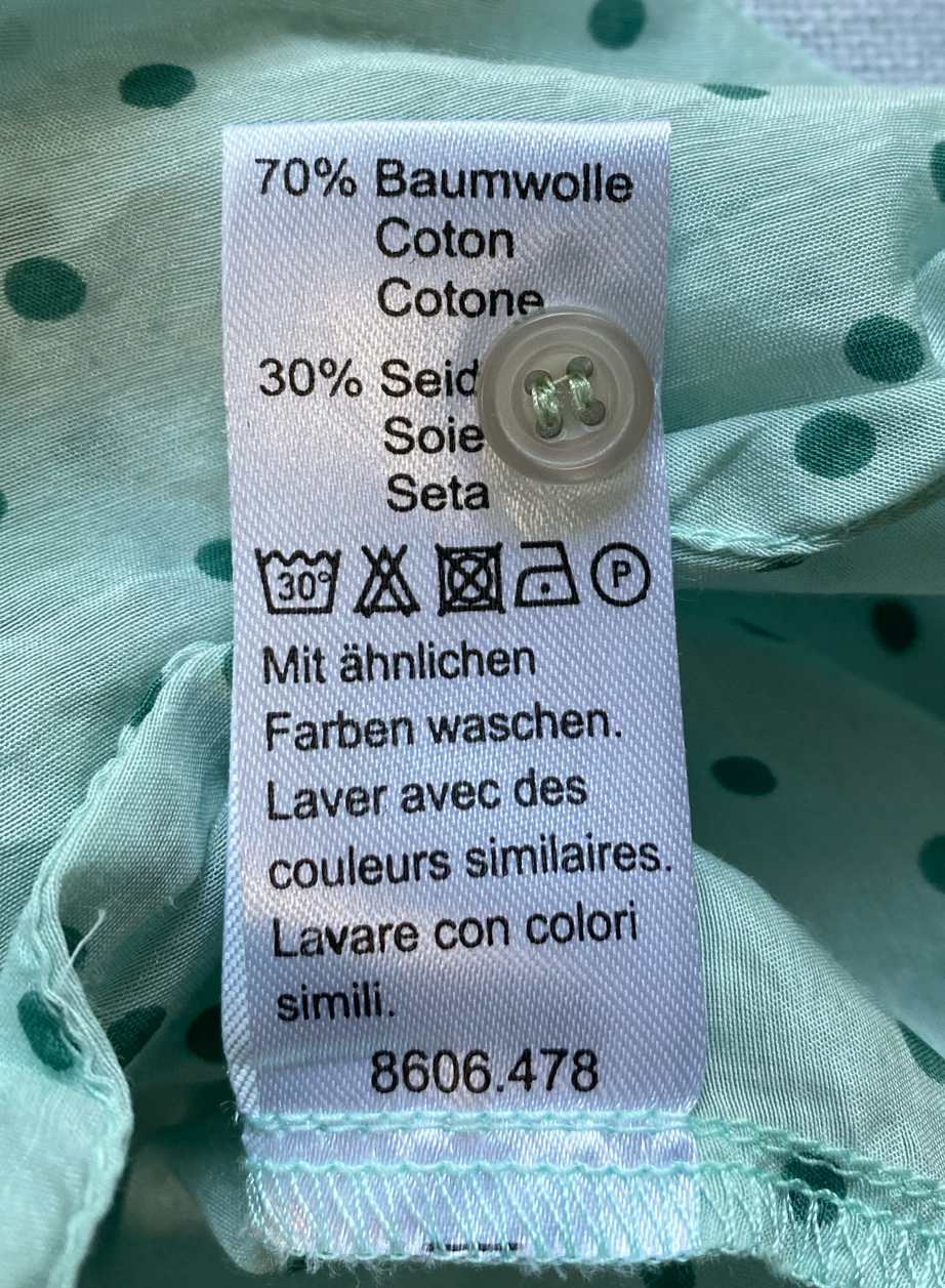 ellen amber Silk Blend Blouse with half-placket button up.Lovely mint-green blouse with polka-dots and button-front