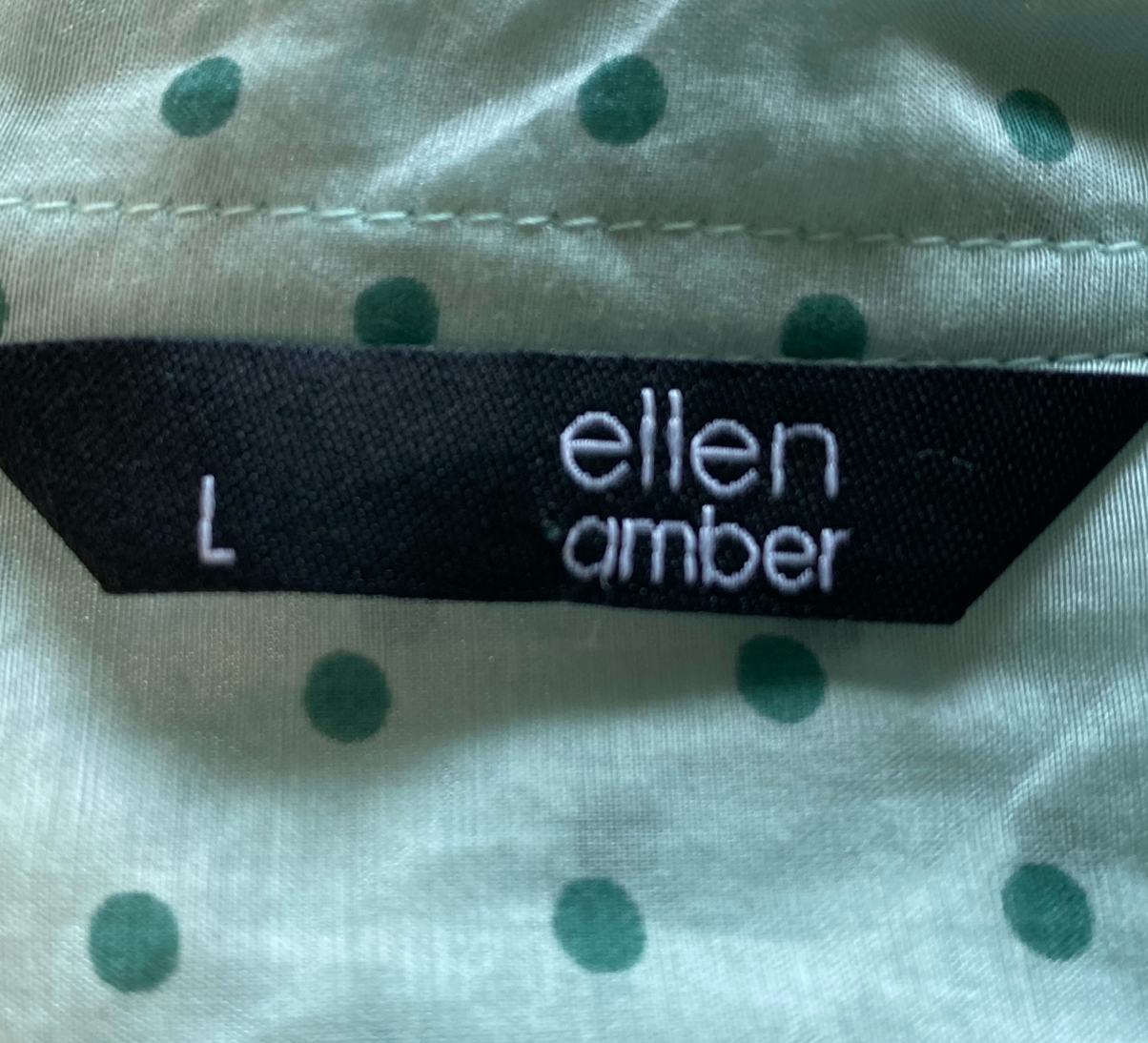 ellen amber Silk Blend Blouse with half-placket button up.Lovely mint-green blouse with polka-dots and button-front